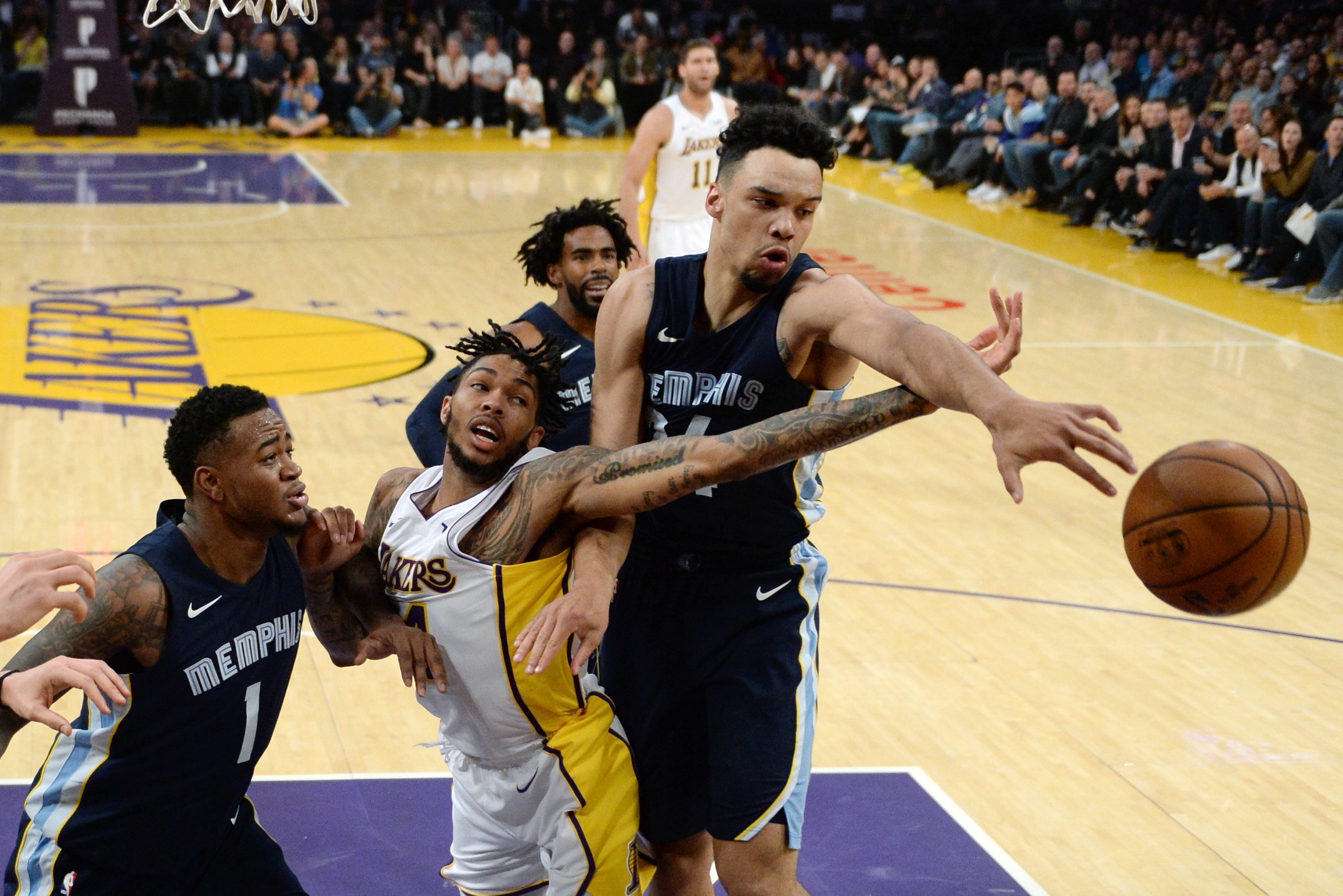LOS ANGELES, CA - NOVEMBER 5: Brandon Ingram #14 of the Los Angeles Lakers has the ball knocked out of his hands by Dillon Brooks #24 of the Memphis Grizzlies during the first half of the basketball game at Staples Center November 5 2017, in Los Angeles, 