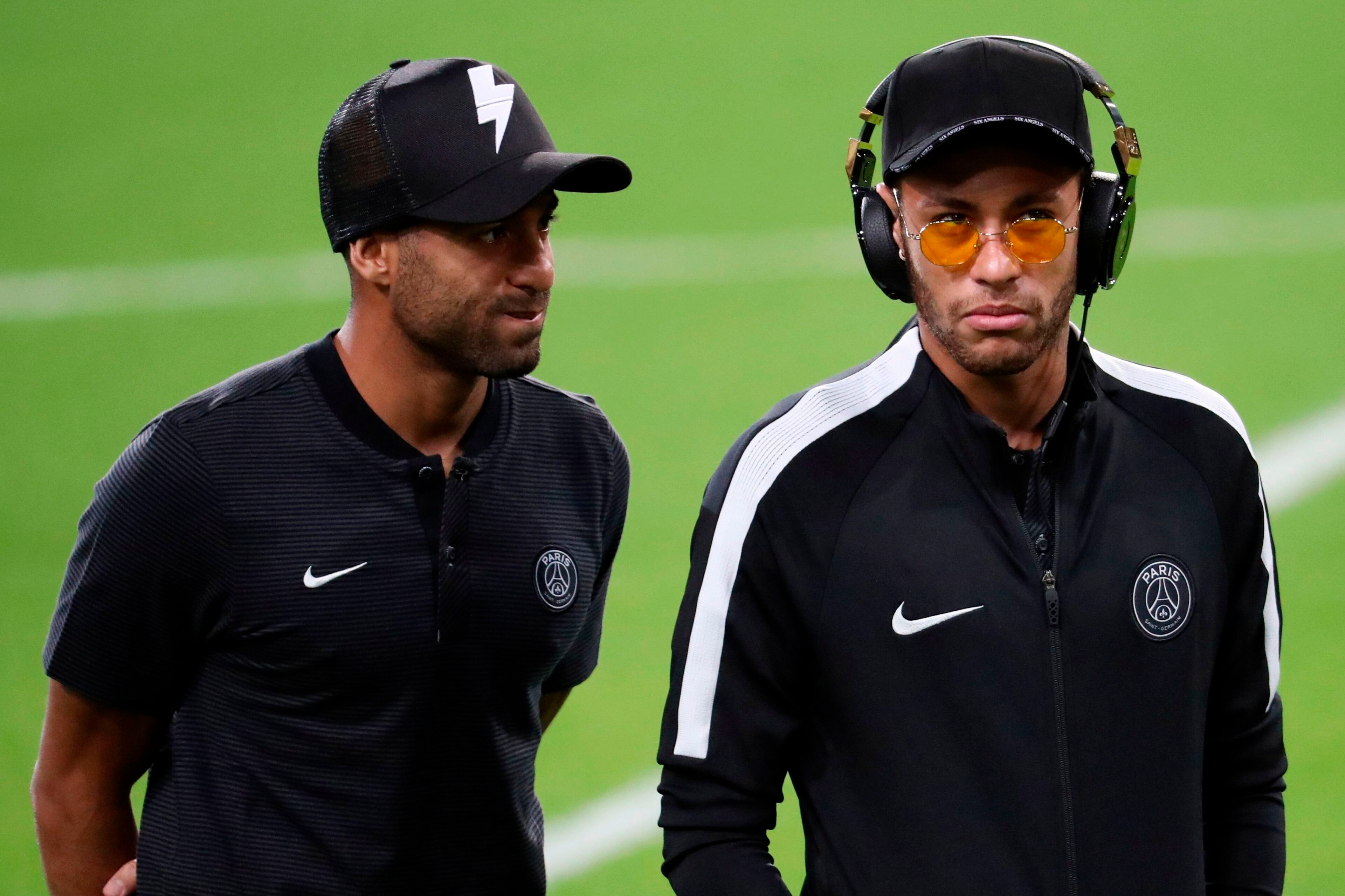 Paris Saint-Germain's Brazilian forward Neymar (R) and Paris Saint-Germain's Brazilian forward Lucas (L) attend a training session at the Constant Vanden Stock Stadium in Brussels, on October 17, 2017 on the eve of the UEFA Champions League Group B footba