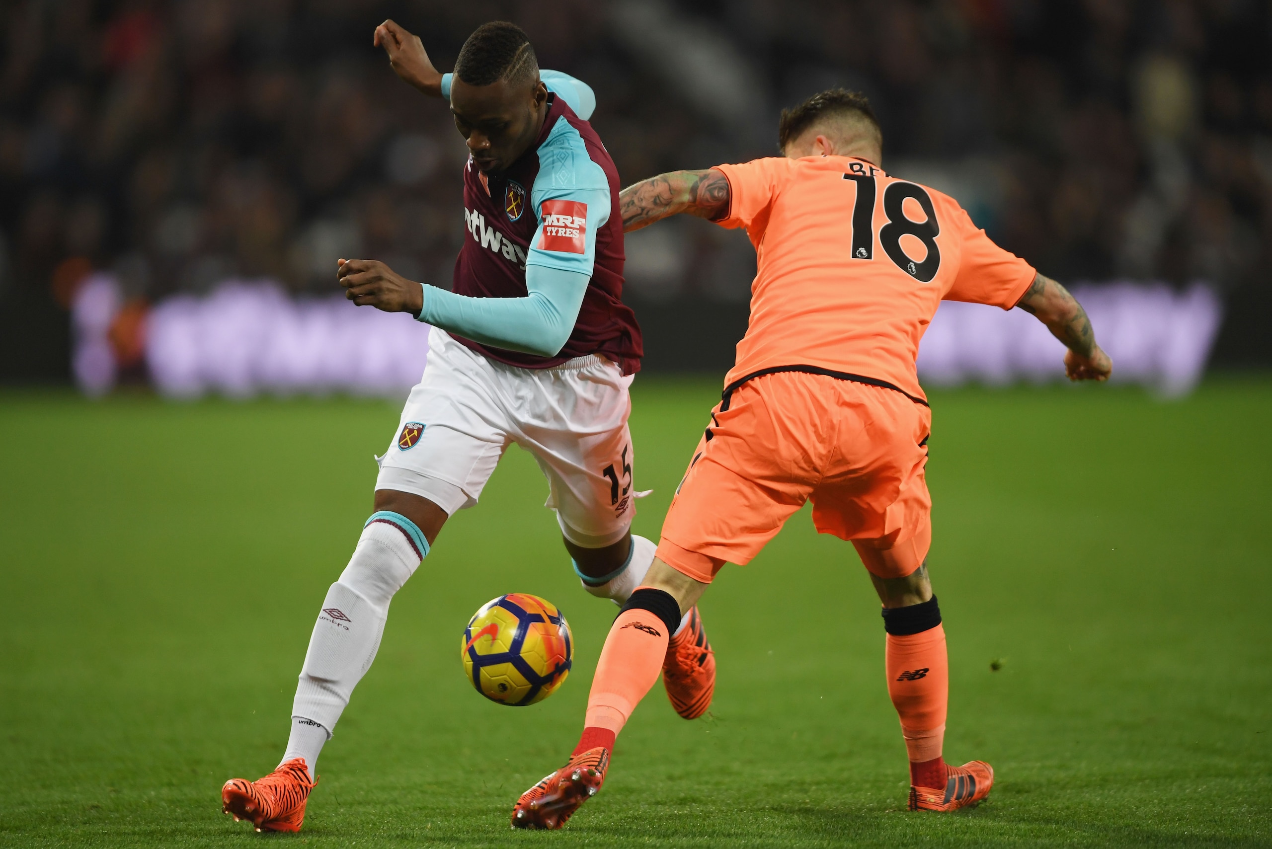 LONDON, ENGLAND - NOVEMBER 04:  Diafra Sakho of West Ham United and Alberto Moreno of Liverpool battle for possession during the Premier League match between West Ham United and Liverpool at London Stadium on November 4, 2017 in London, England.  (Photo b