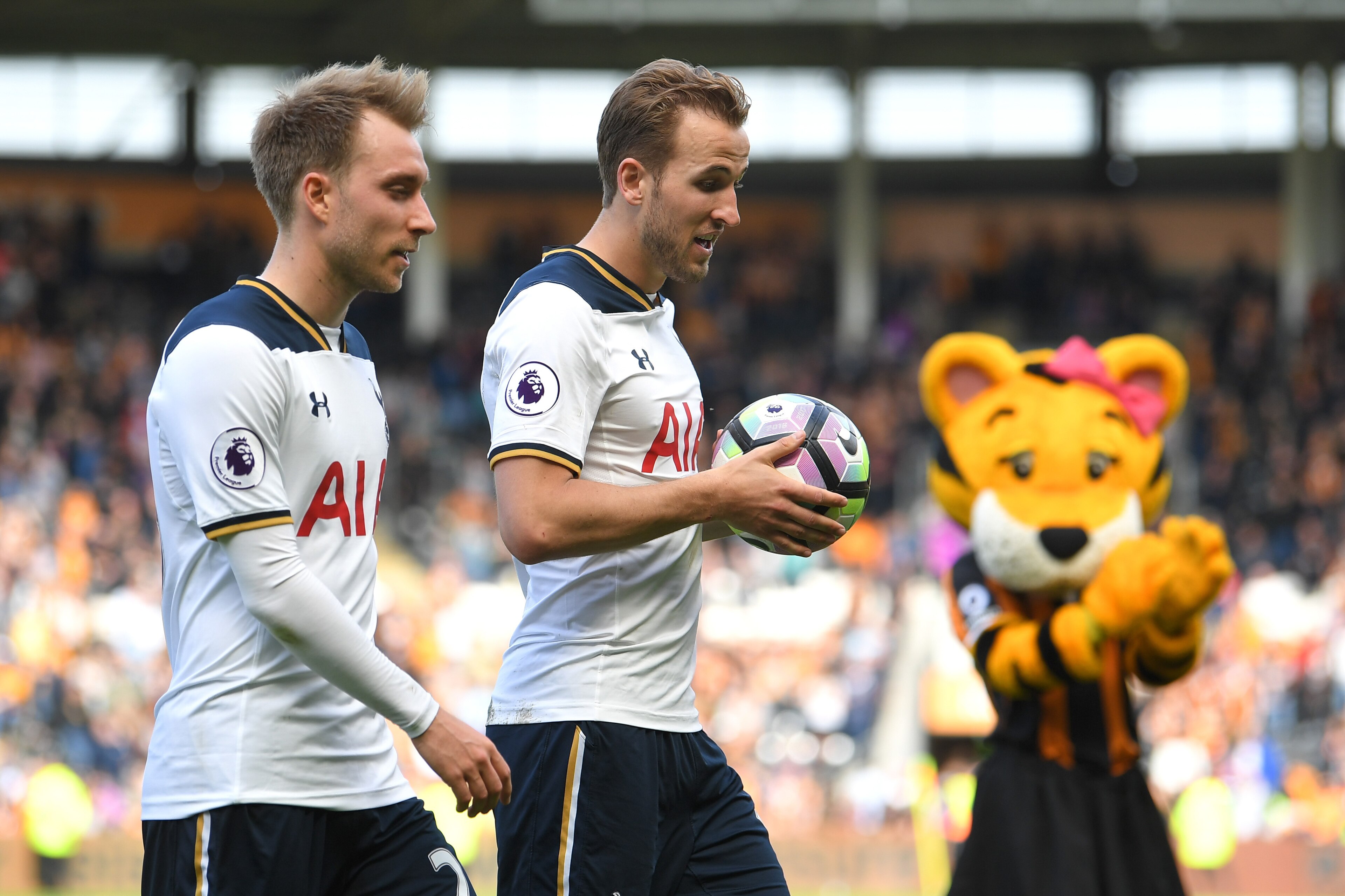 HULL, ENGLAND - MAY 21: Harry Kane of Tottenham Hotspur walks off the pitch alongside Christian Eriksen after scoring a hat-trick and winning the Premier League Golden Boot award during the Premier League match between Hull City and Tottenham Hotspur at K