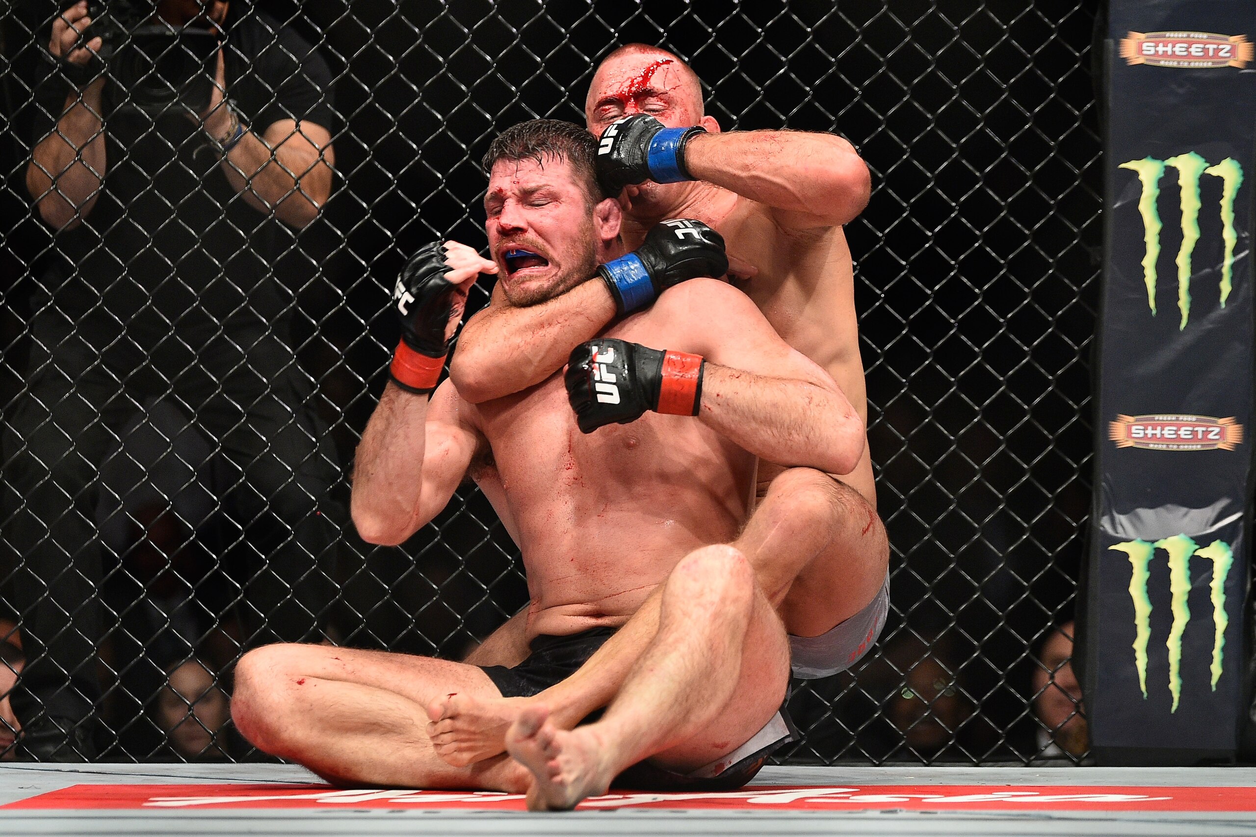 NEW YORK, NY - NOVEMBER 04:  Georges St-Pierre of Canada brings down Michael Bisping of England in their UFC middleweight championship bout during the UFC 217 event at Madison Square Garden on November 4, 2017 in New York City.  (Photo by Jeff Bottari/Zuf