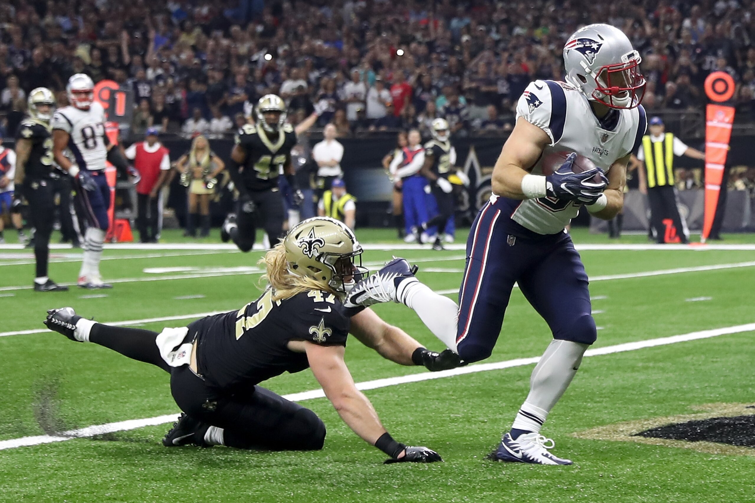 NEW ORLEANS, LA - SEPTEMBER 17: Rex Burkhead #34 of the New England Patriots scores a touchdown over Alex Anzalone #47 of the New Orleans Saints at the Mercedes-Benz Superdome on September 17, 2017 in New Orleans, Louisiana. (Photo by Chris Graythen/G NEW ORLEANS, LA - SEPTEMBER 17: Rex Burkhead #34 of the New England Patriots scores a touchdown over Alex Anzalone #47 of the New Orleans Saints at the Mercedes-Benz Superdome on September 17, 2017 in New Orleans, Louisiana. (Photo by Chris Graythen/G