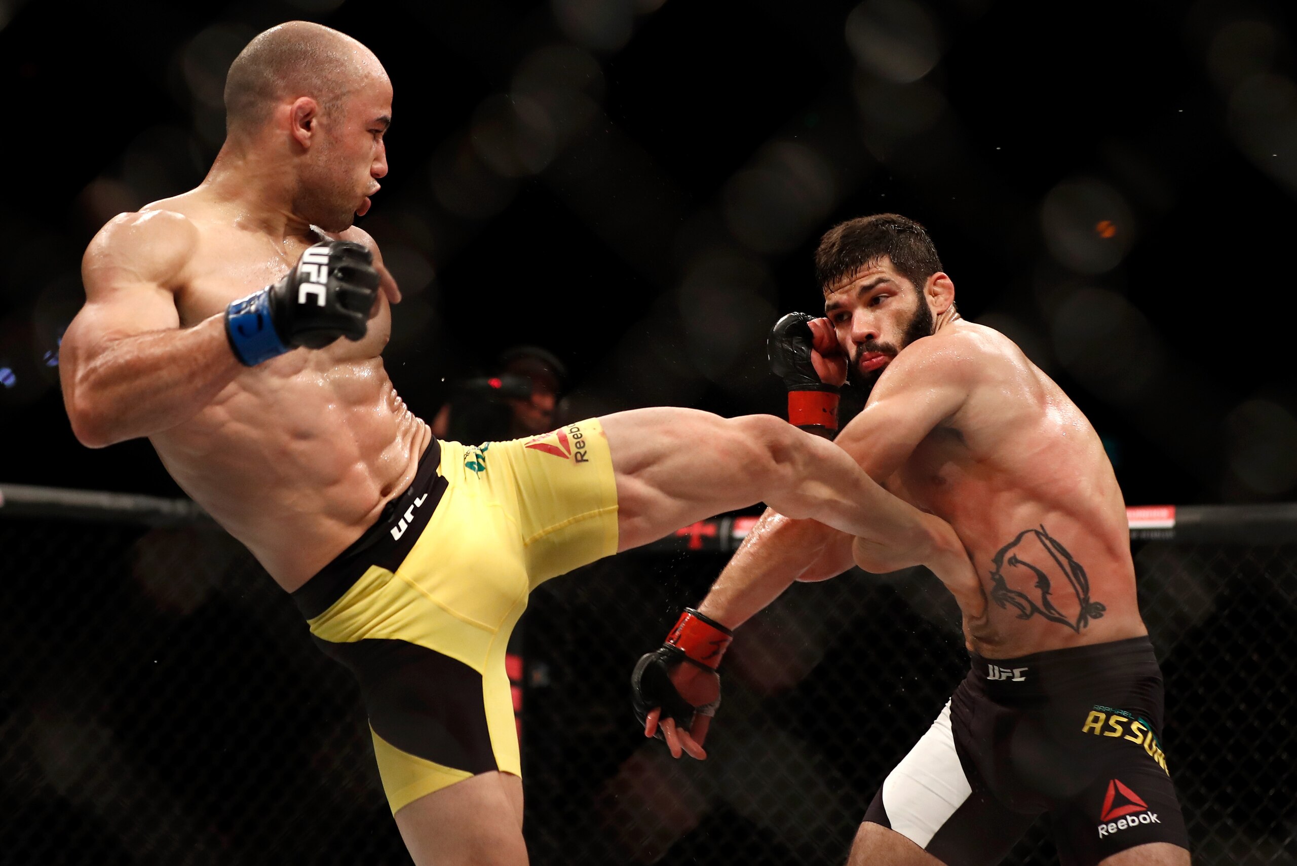 RIO DE JANEIRO, BRAZIL - JUNE 03: (L-R) Marlon Moraes kicks Raphael Assuncao of Brazil in their bantamweight bout during the UFC 212 event at Jeunesse Arena on June 3, 2017 in Rio de Janeiro, Brazil. (Photo by Buda Mendes/Zuffa LLC/Zuffa LLC via Getty Im RIO DE JANEIRO, BRAZIL - JUNE 03: (L-R) Marlon Moraes kicks Raphael Assuncao of Brazil in their bantamweight bout during the UFC 212 event at Jeunesse Arena on June 3, 2017 in Rio de Janeiro, Brazil. (Photo by Buda Mendes/Zuffa LLC/Zuffa LLC via Getty Im