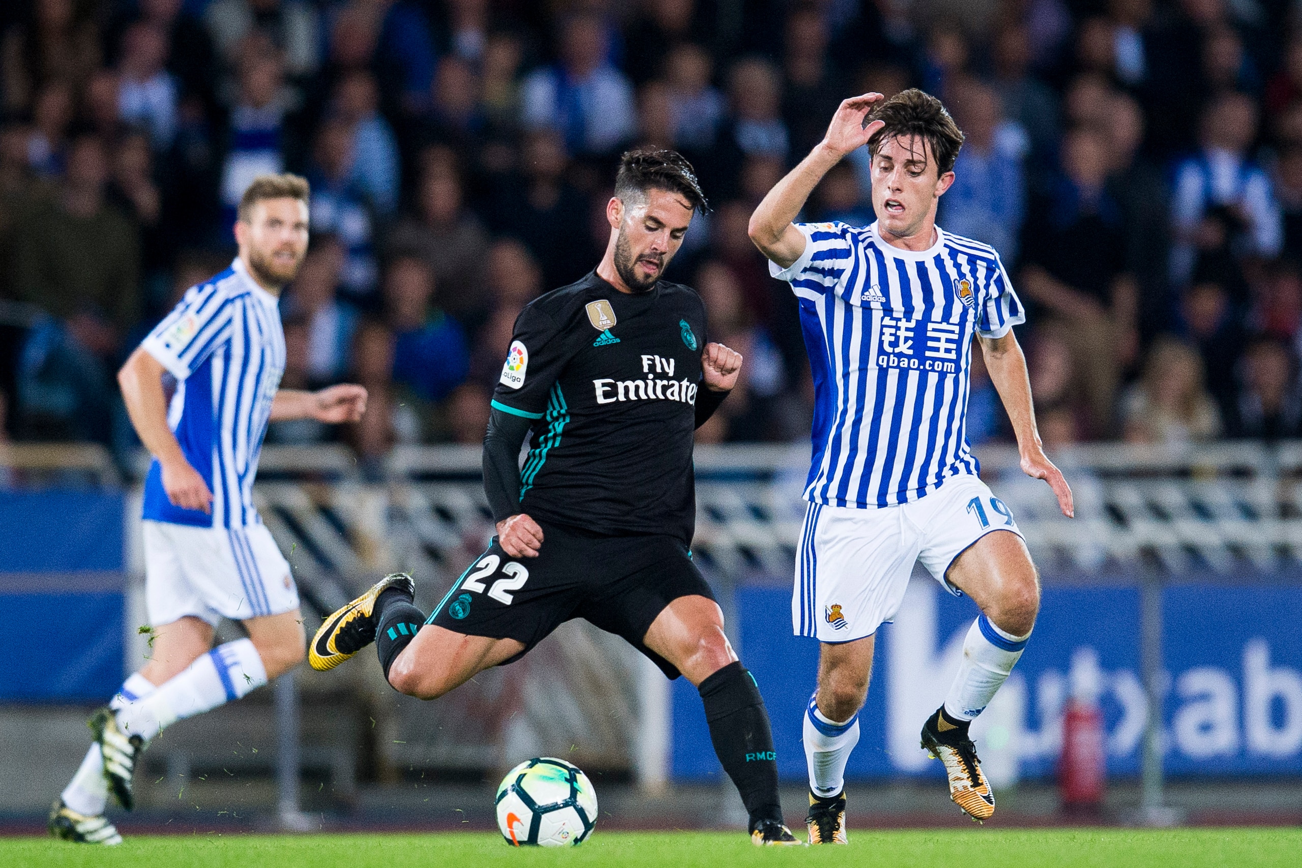 SAN SEBASTIAN, SPAIN - SEPTEMBER 17:  Isco of Real Madrid duels for the ball with Alvaro Odriozola of Real Sociedad during the La Liga match between Real Sociedad de Futbol and Real Madrid at Estadio Anoeta on September 17, 2017 in San Sebastian, Spain . 