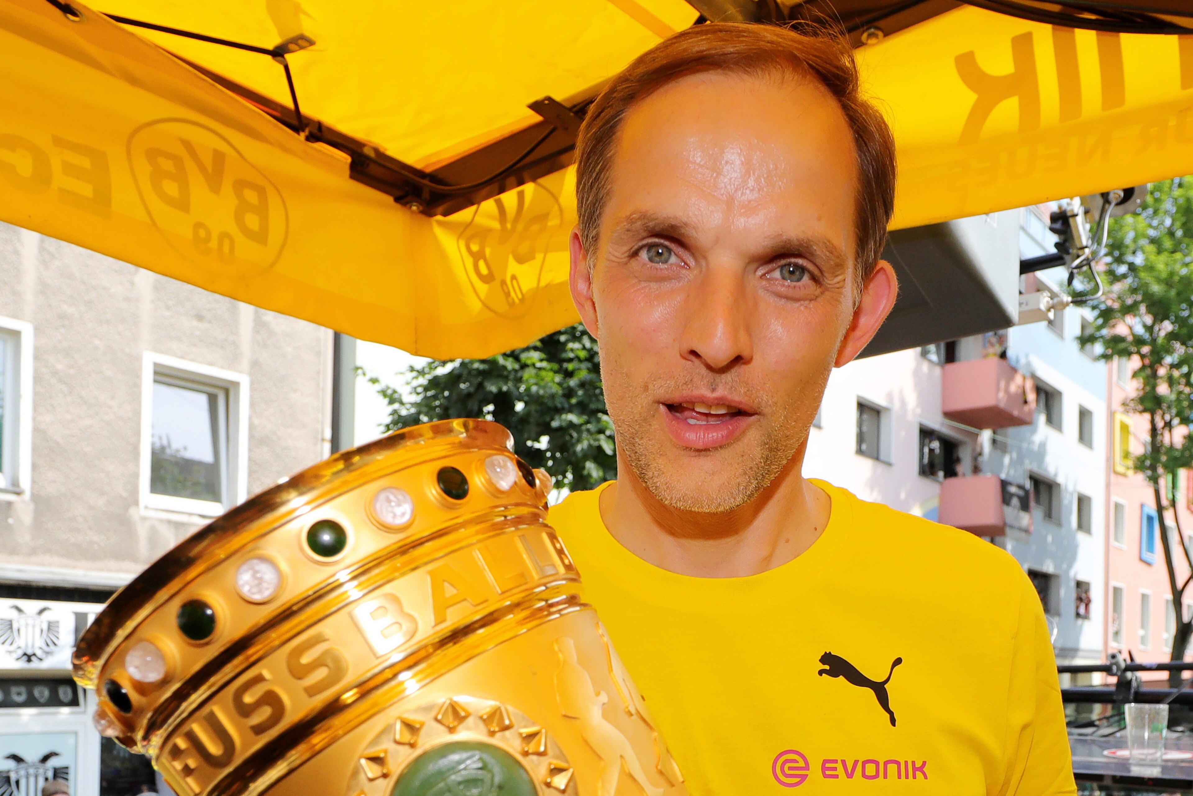 DORTMUND, GERMANY - MAY 28: Trainer Thomas Tuchel of Borussia Dortmund lifts the DFB Cup trophy as the team celebrates during a winner's parade at Borsigplatz on May 28, 2017 in Dortmund, Germany.  (Photo by Pool - Getty Images)