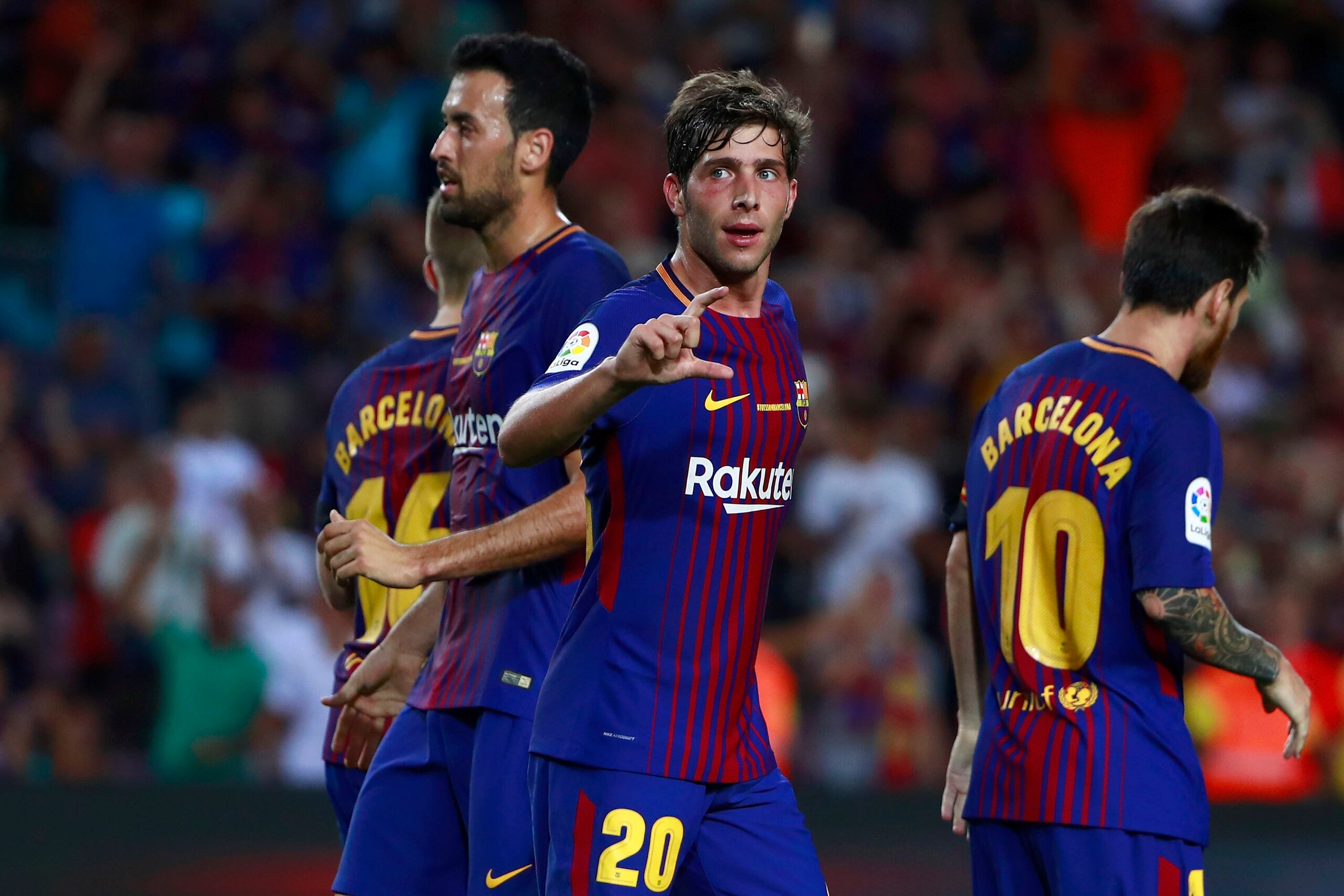 BARCELONA, SPAIN - AUGUST 20:  Sergi Roberto (L) of FC Barcelona celebrates scoring their second goal with teammates during the La Liga match between FC Barcelona and Real Betis Balompie at Camp Nou stadium on August 20, 2017 in Barcelona, Spain.  (Photo 