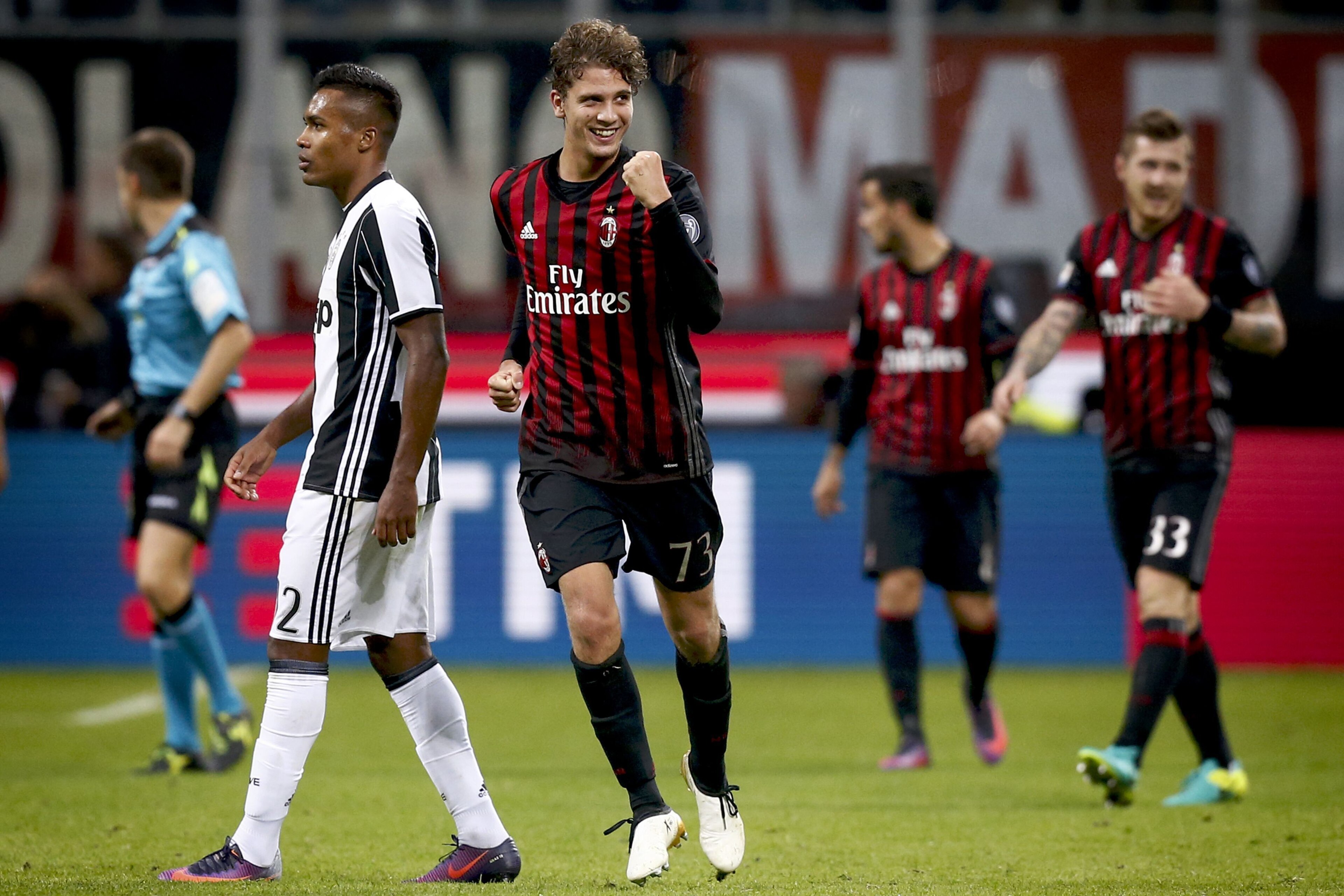AC Milan's midfielder Manuel Locatelli (C) celebrates after scoring a goal during the Italian Serie A football match AC Milan versus Juventus on October 22, 2016 at the San Siro Stadium in Milan.  / AFP / MARCO BERTORELLO        (Photo credit should read 