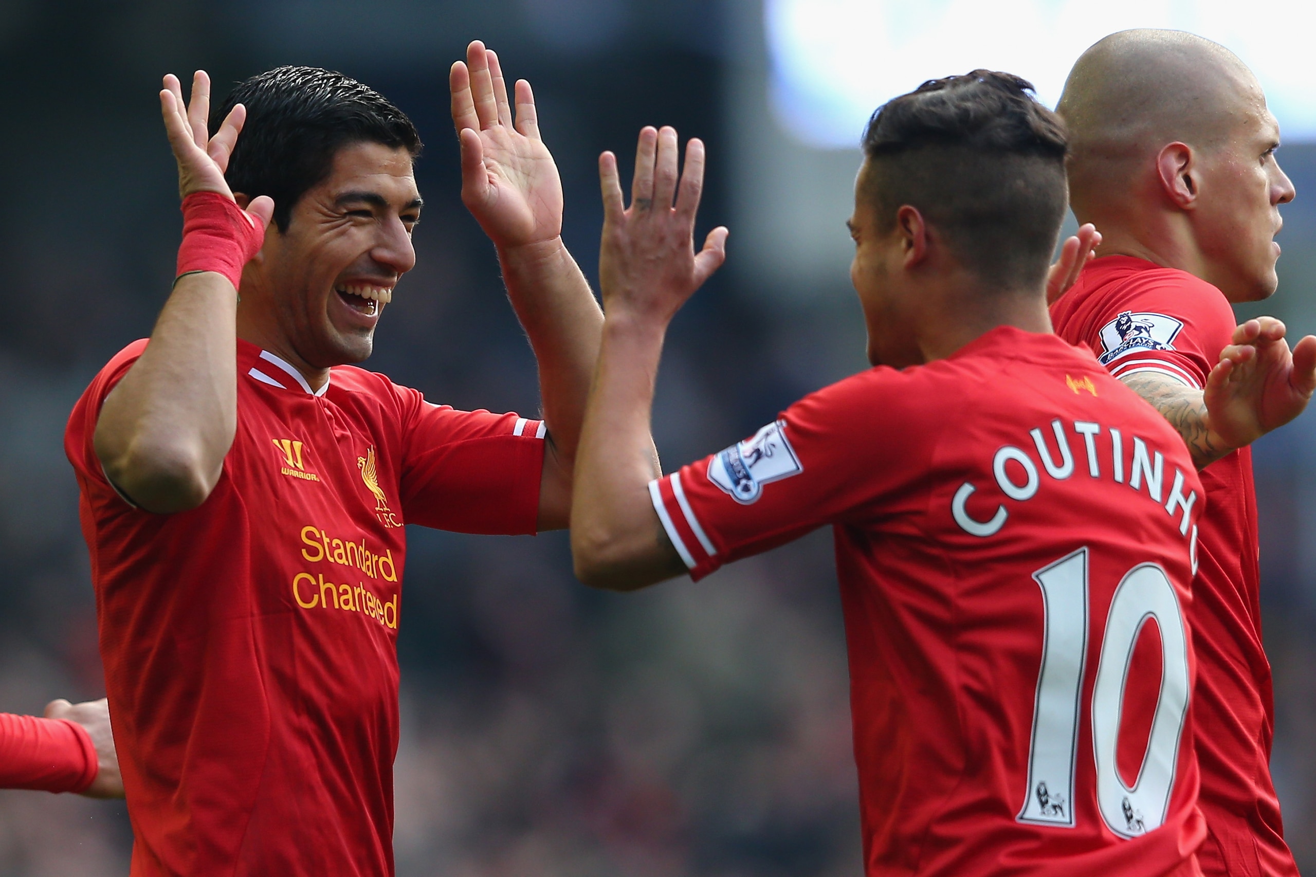 LIVERPOOL, ENGLAND - NOVEMBER 23:  Luis Suarez of Liverpool celebrates scoring his team's second goal with team-mate Coutinho during the Barclays Premier League match between Everton and Liverpool at Goodison Park on November 23, 2013 in Liverpool, Englan