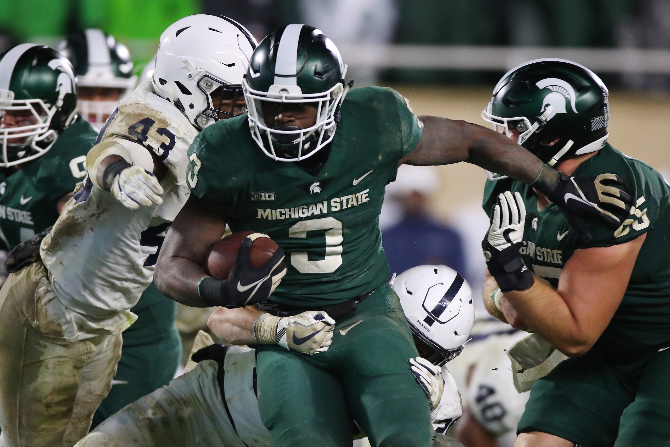 EAST LANSING, MI - NOVEMBER 04: LJ Scott #3 of the Michigan State Spartans battles for yards past Manny Bowen #43 of the Penn State Nittany Lions during the second half at Spartan Stadium on November 4, 2017 in East Lansing, Michigan. Michigan State won t EAST LANSING, MI - NOVEMBER 04: LJ Scott #3 of the Michigan State Spartans battles for yards past Manny Bowen #43 of the Penn State Nittany Lions during the second half at Spartan Stadium on November 4, 2017 in East Lansing, Michigan. Michigan State won t