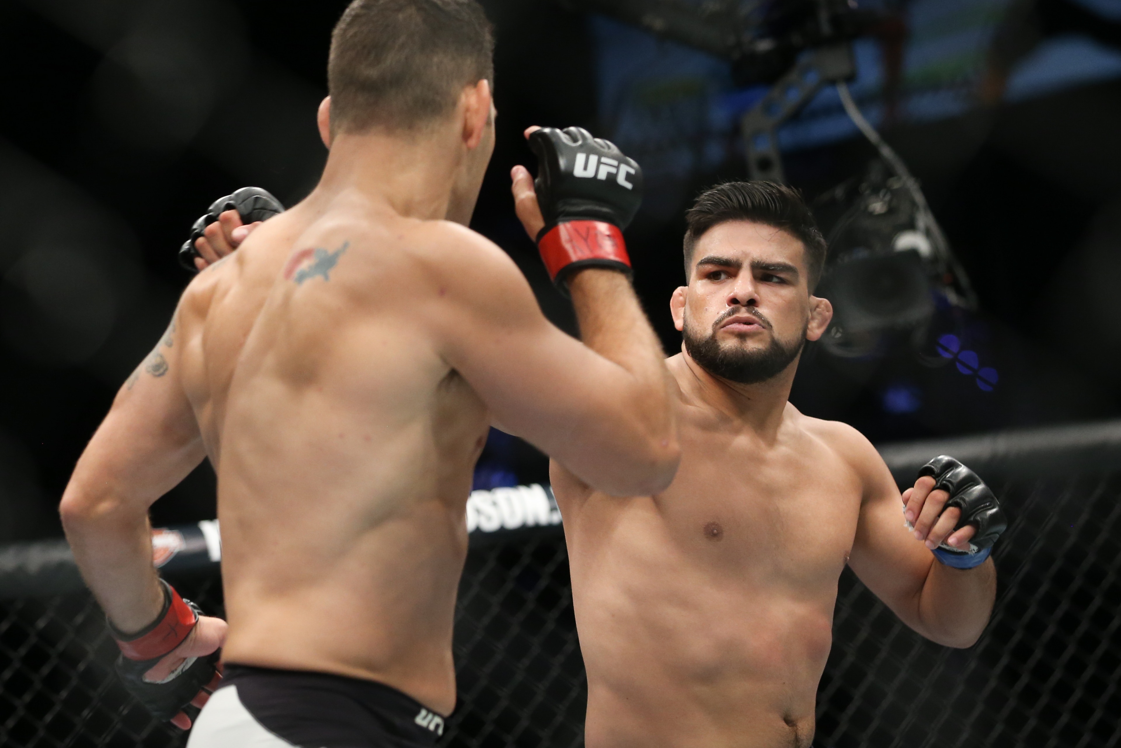UNIONDALE, NY - JULY 22: Chris Weidman (L) and Kelvin Gastelum (R) trade punches during their UFC Fight Night middleweight bout at the Nassau Veterans Memorial Coliseum on July 22, 2017 in Uniondale, New York. (Photo by Ed Mulholland/Getty Images) UNIONDALE, NY - JULY 22: Chris Weidman (L) and Kelvin Gastelum (R) trade punches during their UFC Fight Night middleweight bout at the Nassau Veterans Memorial Coliseum on July 22, 2017 in Uniondale, New York. (Photo by Ed Mulholland/Getty Images)