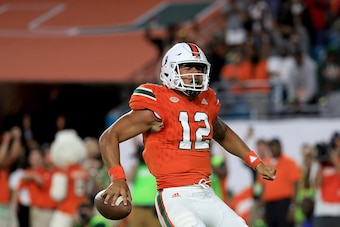 MIAMI GARDENS, FL - NOVEMBER 11:  Malik Rosier #12 of the Miami Hurricanes scores a touchdown during a game against the Notre Dame Fighting Irish at Hard Rock Stadium on November 11, 2017 in Miami Gardens, Florida.  (Photo by Mike Ehrmann/Getty Images)