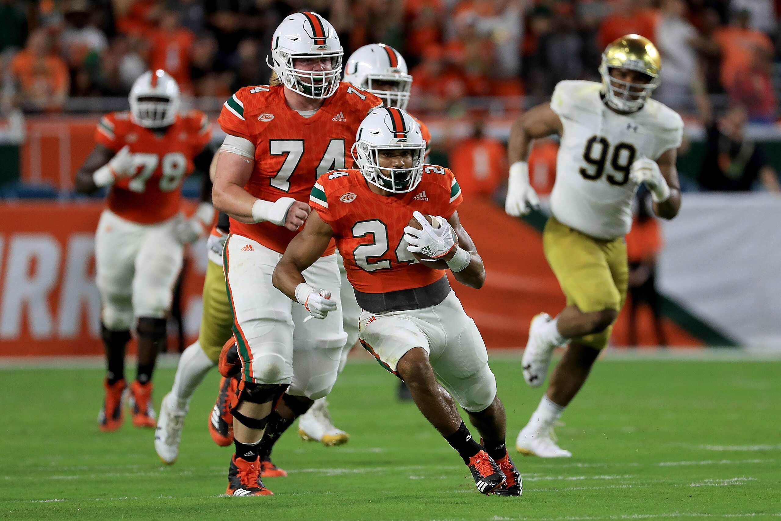 MIAMI GARDENS, FL - NOVEMBER 11:  Travis Homer #24 of the Miami Hurricanes rushes during a game against the Notre Dame Fighting Irish at Hard Rock Stadium on November 11, 2017 in Miami Gardens, Florida.  (Photo by Mike Ehrmann/Getty Images)
