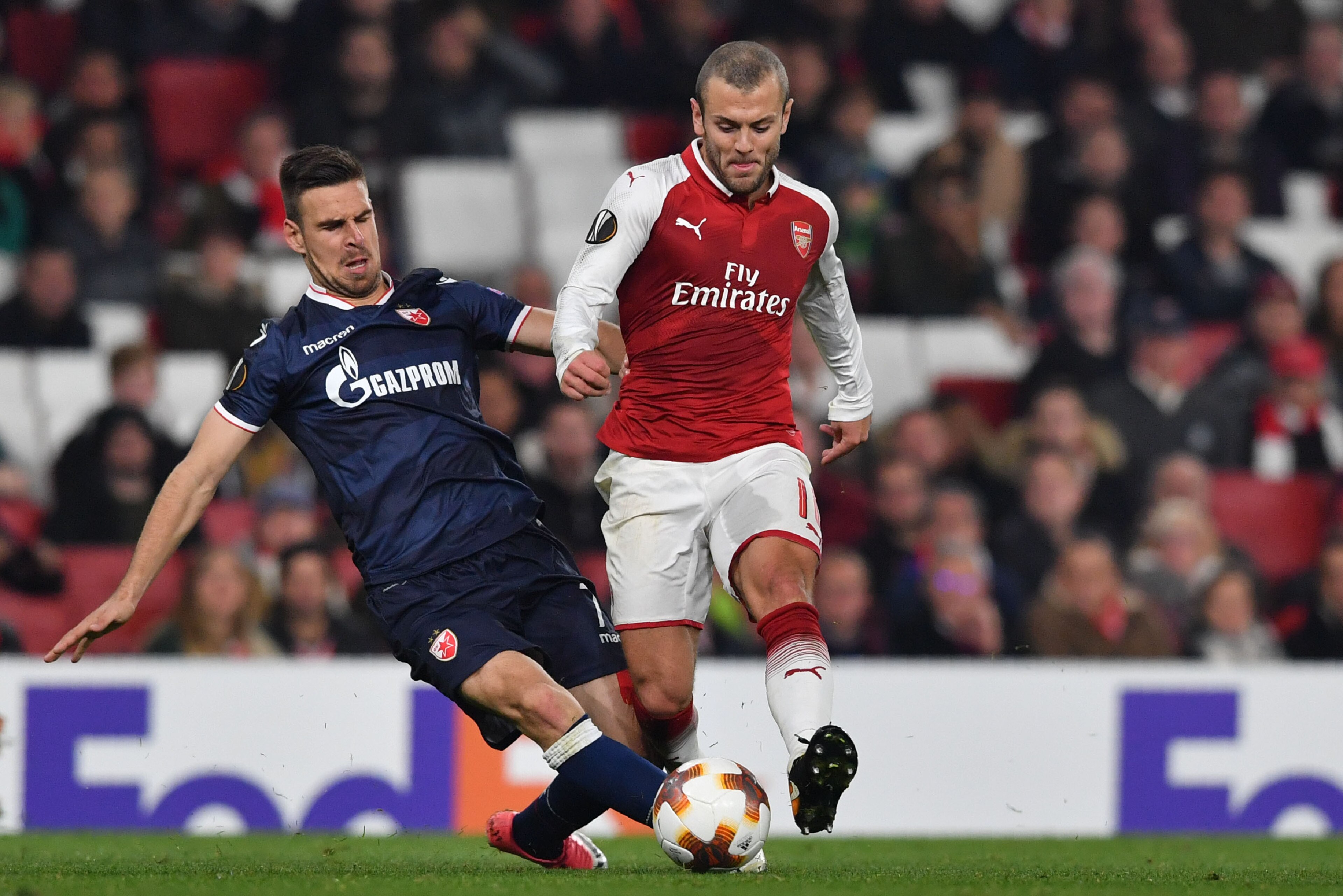 Arsenal's English midfielder Jack Wilshere (R) is tackled by Red Star Belgrade's Serbian midfielder Marko Gobeljic during the UEFA Europa League Group H football match between Arsenal and Red Star Belgrade at The Emirates Stadium in London on November 2, 