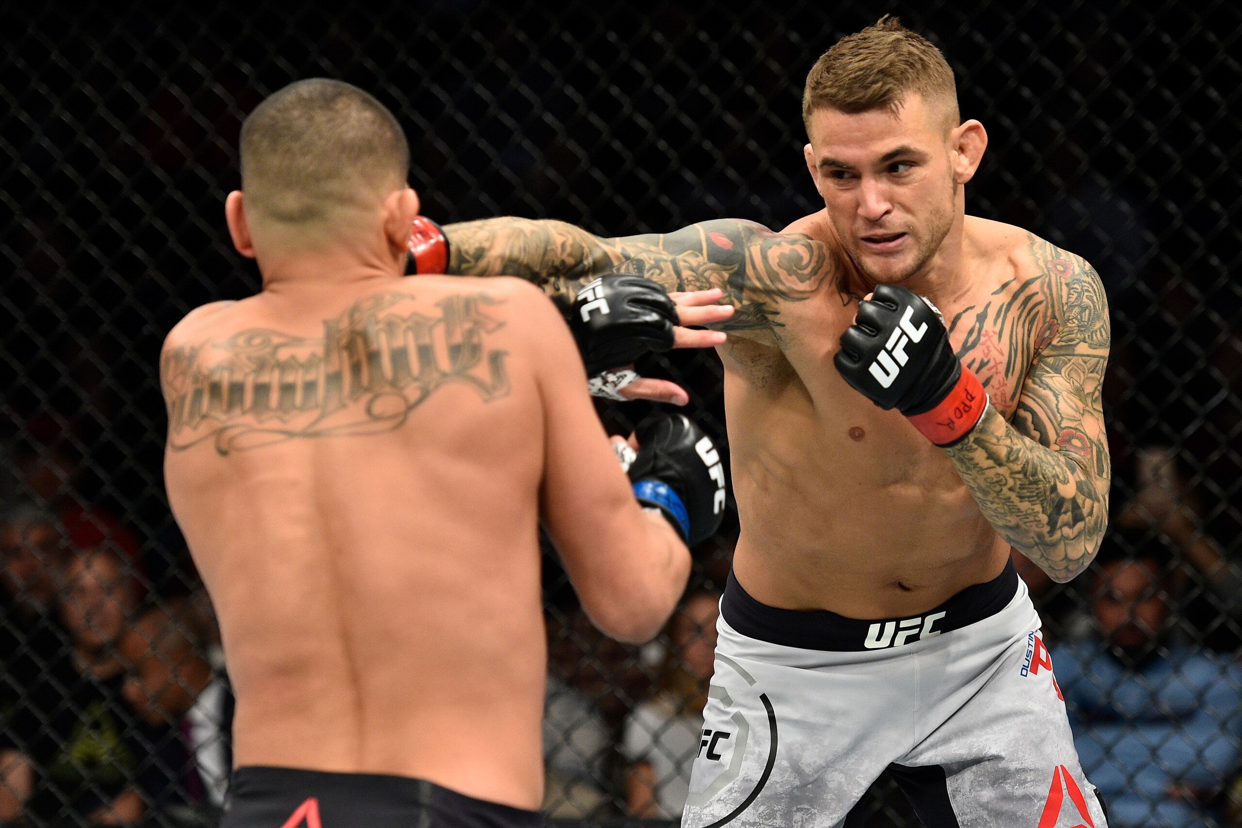 NORFOLK, VA - NOVEMBER 11:  (R-L) Dustin Poirier punches Anthony Pettis in their lightweight bout during the UFC Fight Night event inside the Ted Constant Convention Center on November 11, 2017 in Norfolk, Virginia. (Photo by Brandon Magnus/Zuffa LLC/Zuff