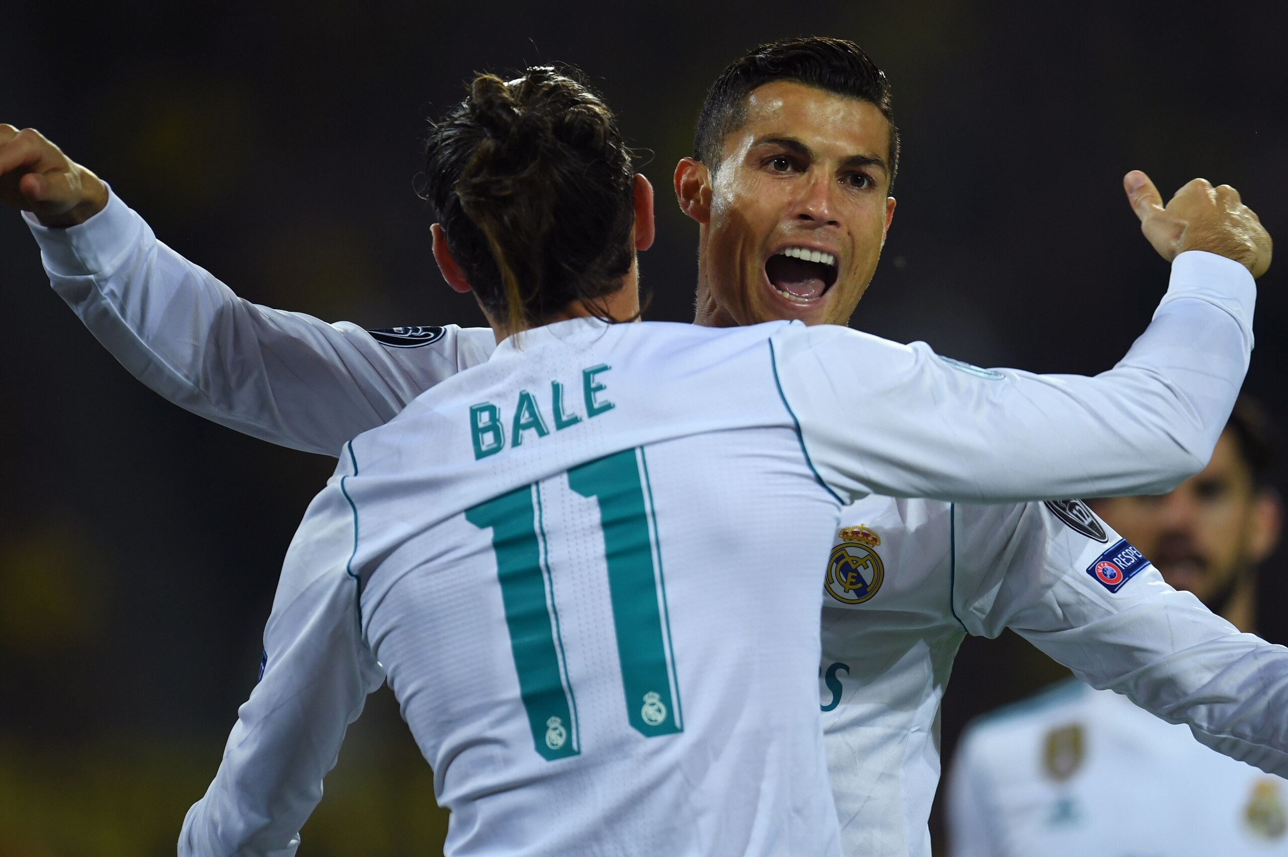 Real Madrid's forward from Portugal Cristiano Ronaldo (R) celebrates scoring with his teammate forward from Wales Gareth Bale during the UEFA Champions League Group H football match BVB Borussia Dortmund v Real Madrid in Dortmund, western Germany on Septe Real Madrid's forward from Portugal Cristiano Ronaldo (R) celebrates scoring with his teammate forward from Wales Gareth Bale during the UEFA Champions League Group H football match BVB Borussia Dortmund v Real Madrid in Dortmund, western Germany on Septe