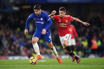 LONDON, ENGLAND - NOVEMBER 05: Alvaro Morata of Chelsea attempts to get away from Ander Herrera of Manchester United during the Premier League match between Chelsea and Manchester United at Stamford Bridge on November 5, 2017 in London, England.  (Photo b