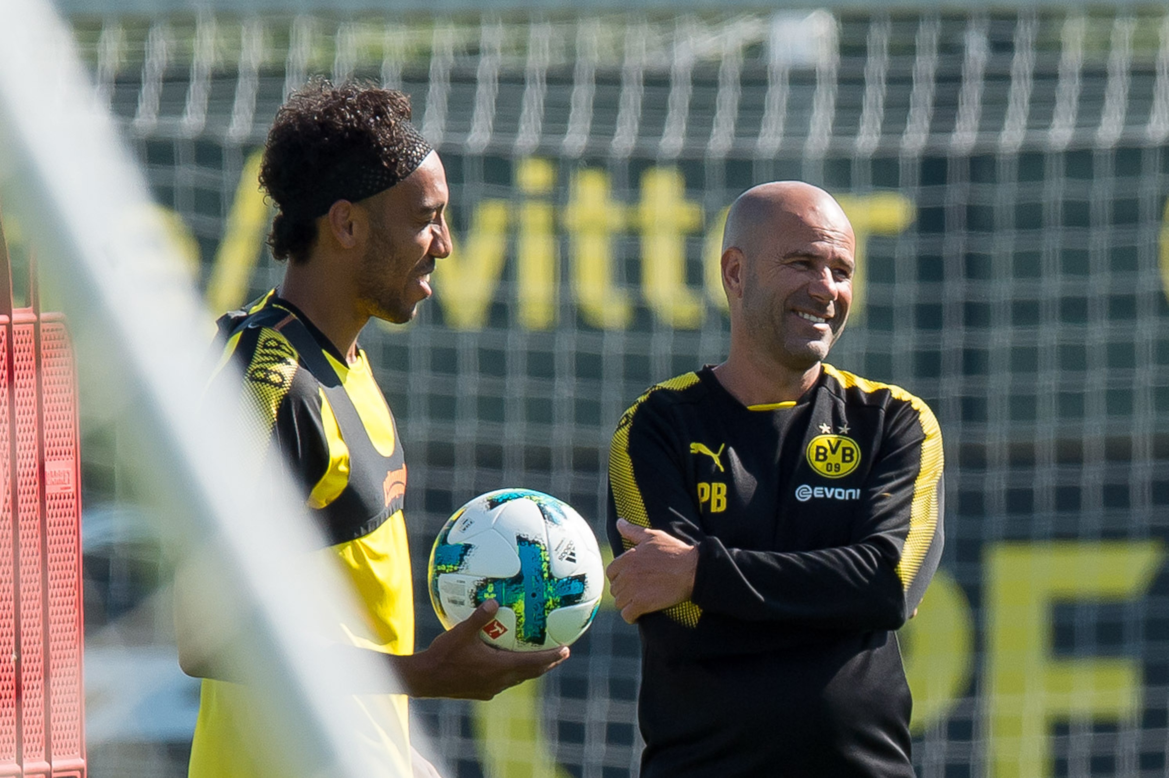 DORTMUND, GERMANY - SEPTEMBER 04: Pierre-Emerick Aubameyang of Dortmund and Head coach Peter Bosz of Dortmund laughs during a training session at the BVB Training center on September 4, 2017 in Dortmund, Germany. (Photo by TF-Images/TF-Images via Getty Im