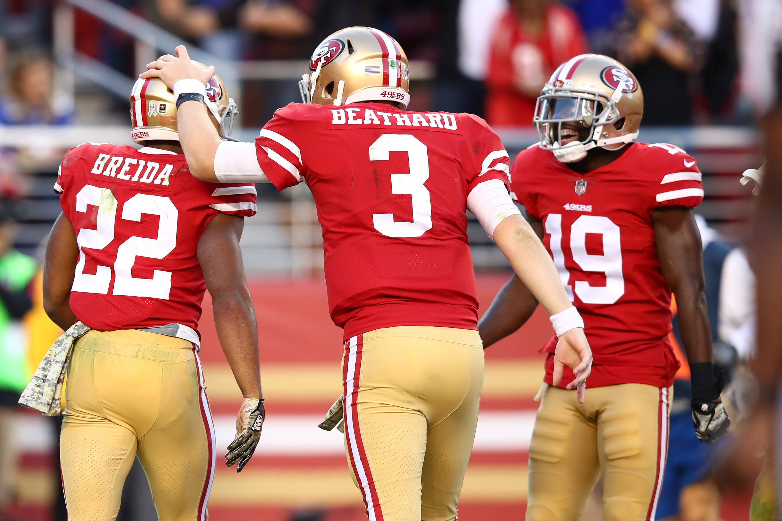 SANTA CLARA, CA - NOVEMBER 12:  Matt Breida #22 of the San Francisco 49ers celebrates with C.J. Beathard #3 after a 22-yard touchdown against the New York Giants during their NFL game at Levi's Stadium on November 12, 2017 in Santa Clara, California.  (Ph