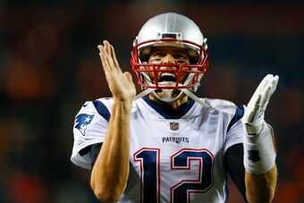 DENVER, CO - NOVEMBER 12:  Quarterback Tom Brady #12 of the New England Patriots reacts as he walks on the field before a game against the Denver Broncos at Sports Authority Field at Mile High on November 12, 2017 in Denver, Colorado. (Photo by Justin Edm