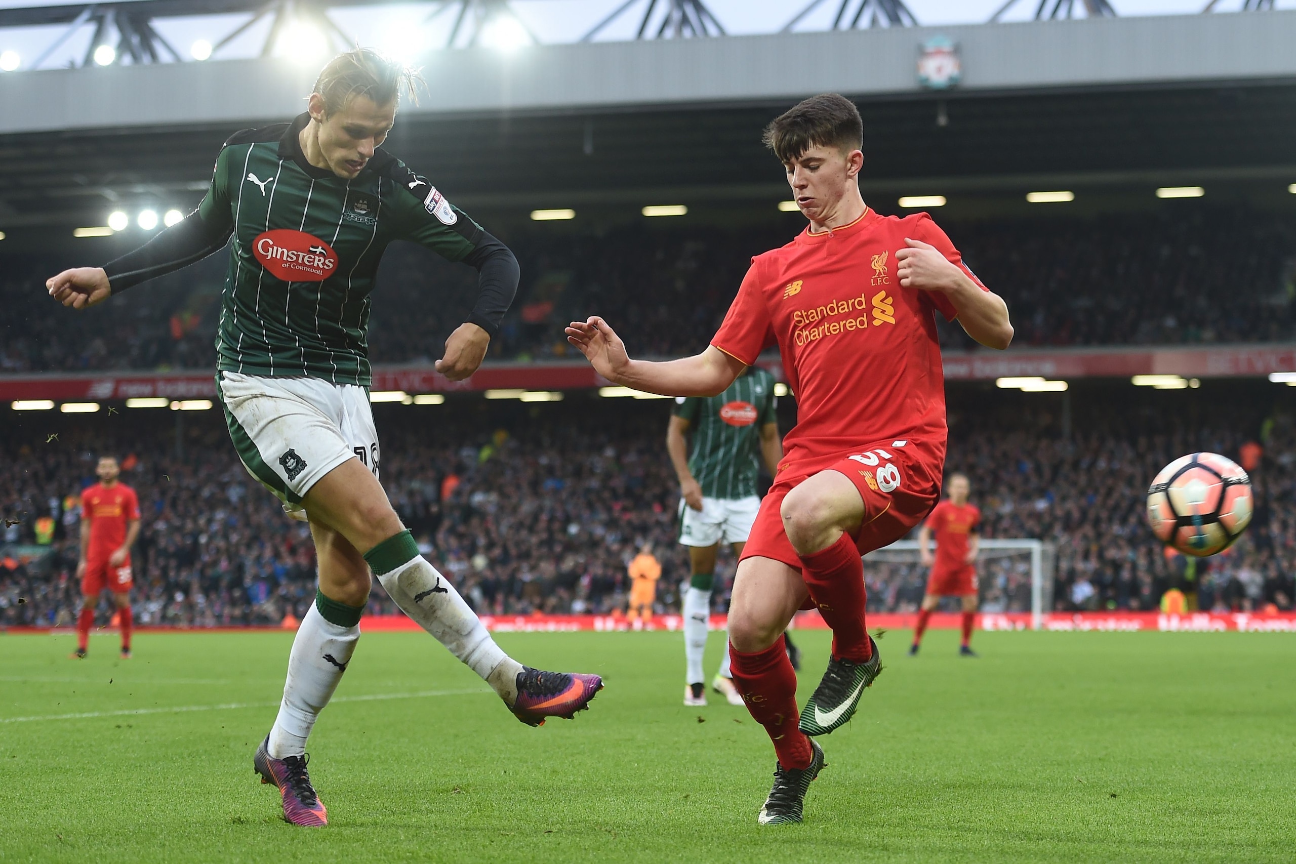 Plymouth's English midfielder Oscar Threlkeld (L) vies with Liverpool's Welsh striker Ben Woodburn during the English FA Cup third round football match between Liverpool and Plymouth Argyle at Anfield in Liverpool, north west England on January 8, 2017. / Plymouth's English midfielder Oscar Threlkeld (L) vies with Liverpool's Welsh striker Ben Woodburn during the English FA Cup third round football match between Liverpool and Plymouth Argyle at Anfield in Liverpool, north west England on January 8, 2017. /