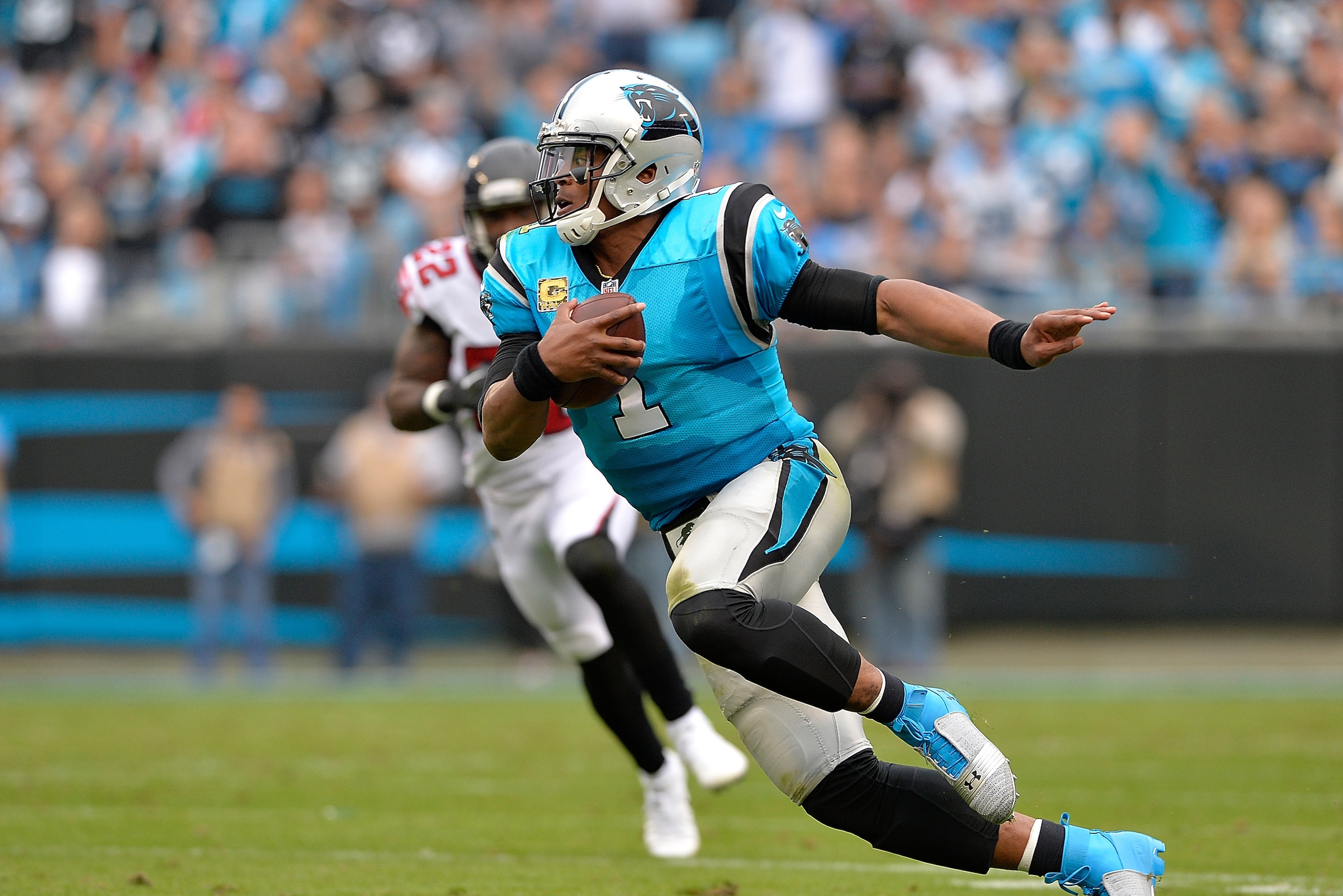CHARLOTTE, NC - NOVEMBER 05: Cam Newton #1 of the Carolina Panthers runs the ball against the Atlanta Falcons in the second quarter during their game at Bank of America Stadium on November 5, 2017 in Charlotte, North Carolina.  (Photo by Grant Halverson/G