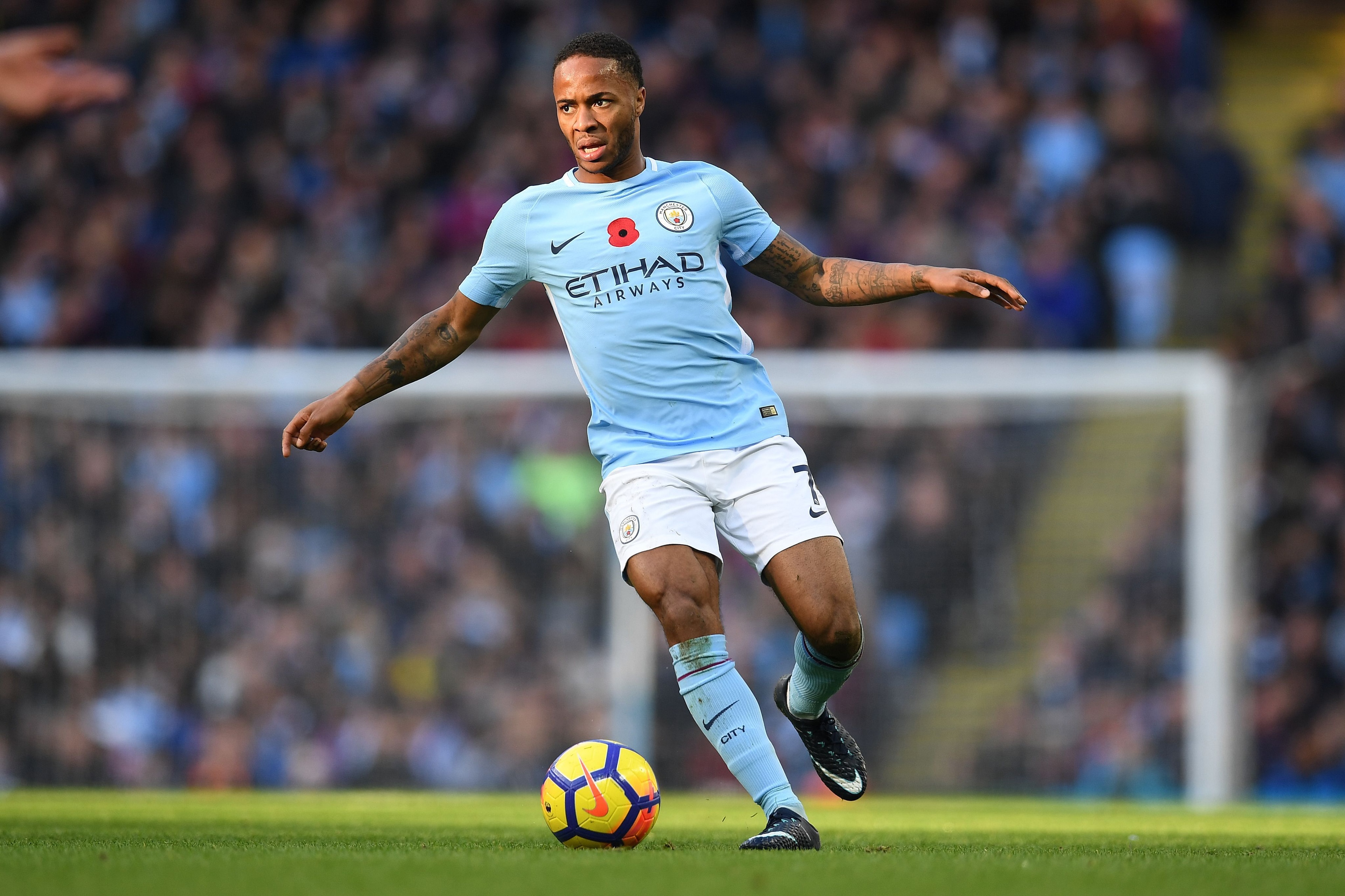 Manchester City's English midfielder Raheem Sterling controls the ball during the English Premier League football match between Manchester City and Arsenal at the Etihad Stadium in Manchester, north west England, on November 5, 2017. / AFP PHOTO / Paul EL