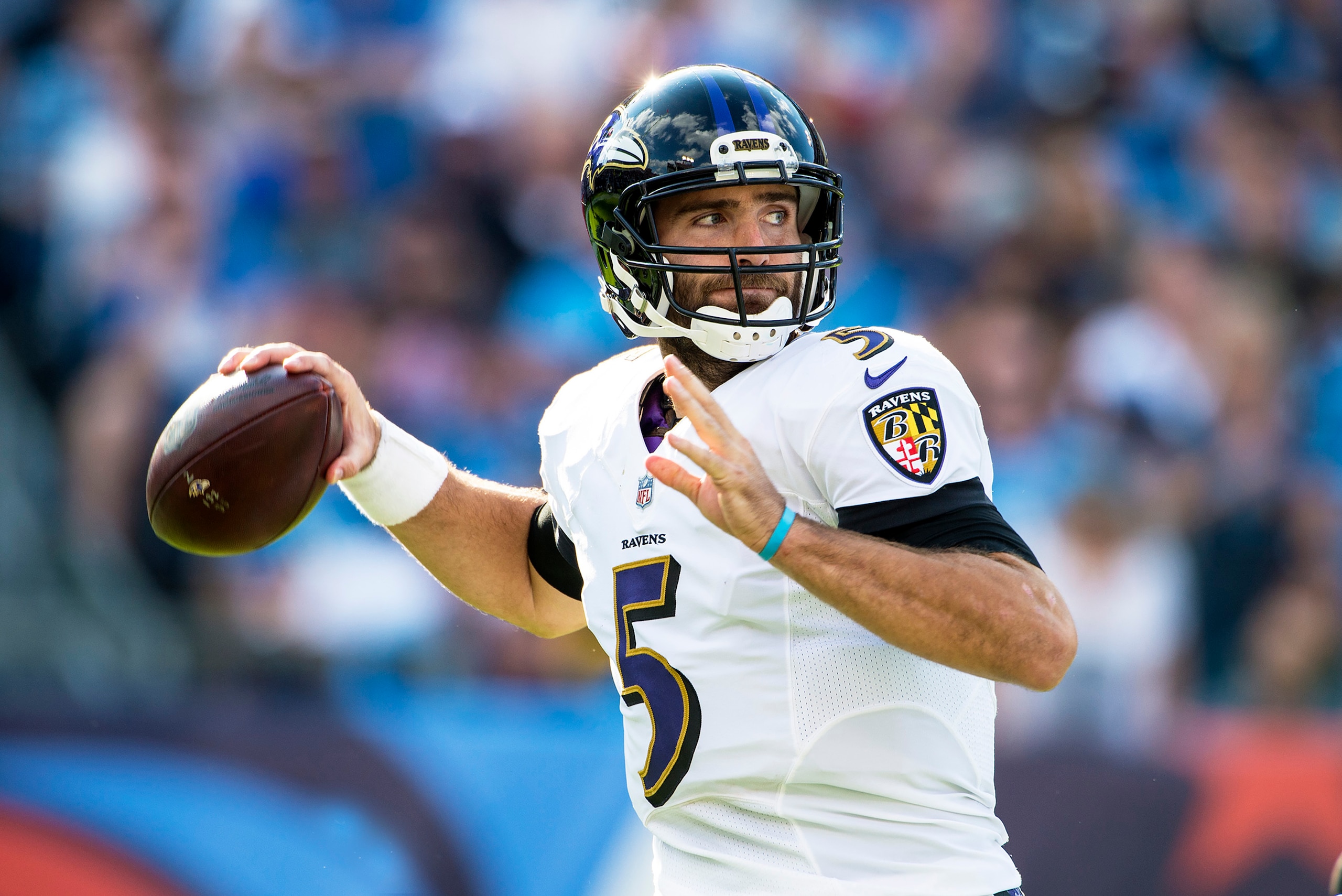 NASHVILLE, TN - NOVEMBER 5:  Quarterback Joe Flacco #5 of the Baltimore Ravens looks for a receiver during a NFL game against the Baltimore Ravens at Nissan Stadium on November 5, 2017 in Nashville, Tennessee.  (Photo by Ronald C. Modra/Sports Imagery/Get