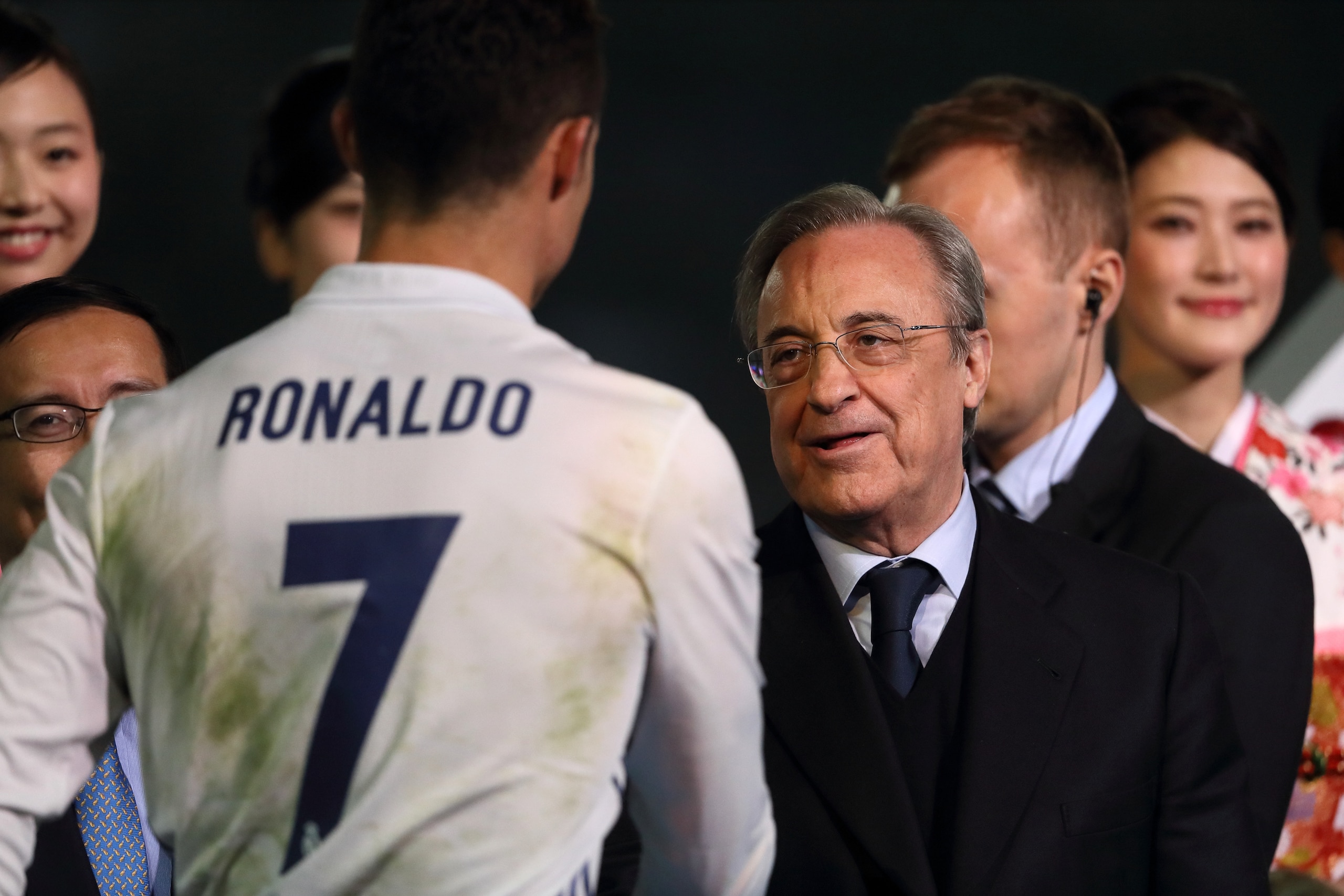 YOKOHAMA, JAPAN - DECEMBER 18:  Cristiano Ronaldo of Real Madrid is congratulated by Real Madrid President Florentino Perez at the end of the FIFA Club World Cup final match between Real Madrid and Kashima Antlers at International Stadium Yokohama on Dece