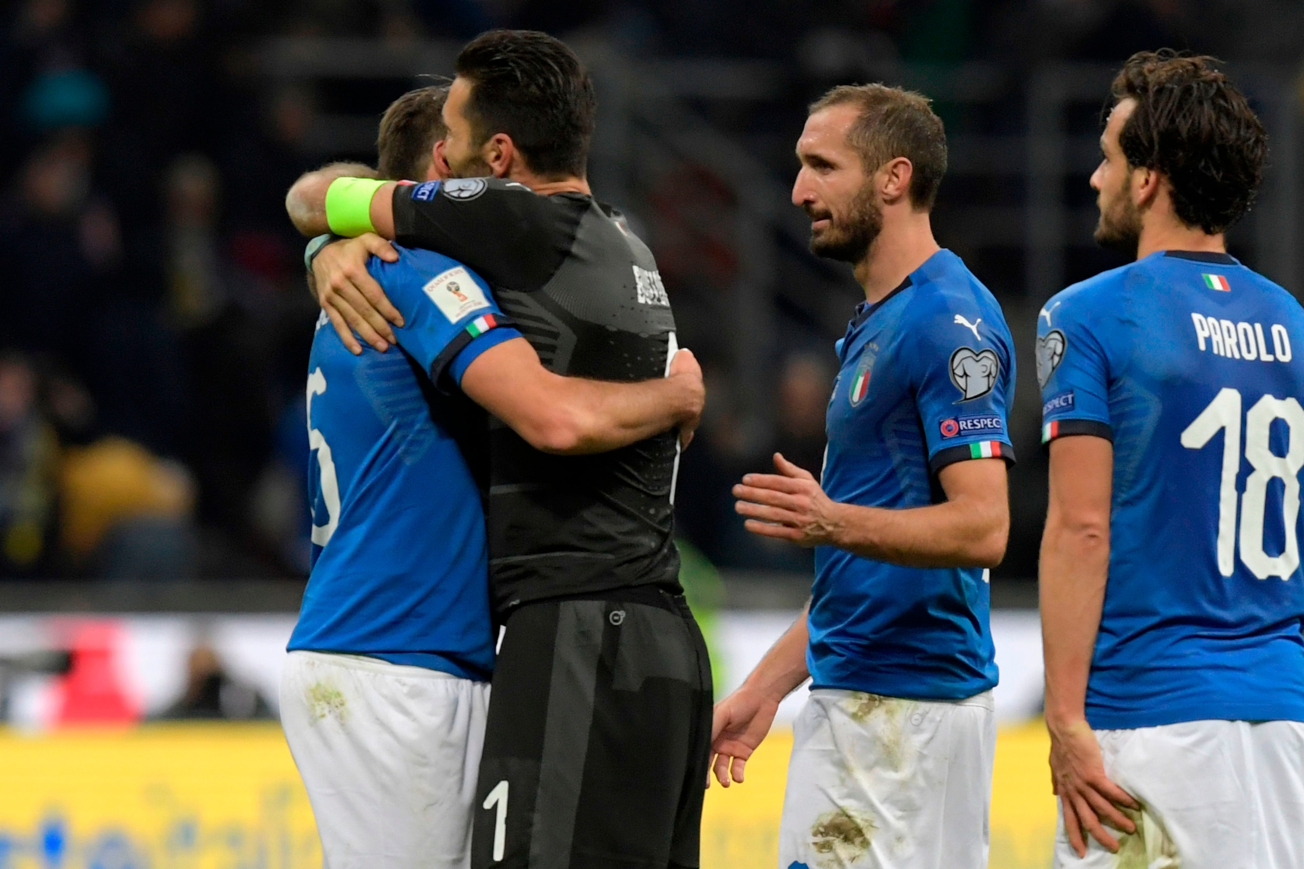 TOPSHOT - From left : Italy's defender Andrea Barzagli, Italy's goalkeeper Gianluigi Buffon, Italy's midfielder Giorgio Chiellini and Italy's midfielder Marco Parolo react at the end of the FIFA World Cup 2018 qualification football match between Italy an