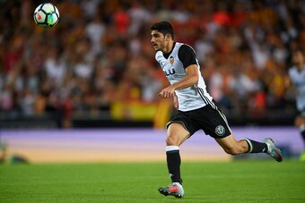 VALENCIA, SPAIN - OCTOBER 21:  Goncalo Guedes of Valencia celebrates scoring his team's fouth goal with his teammate Geoffrey Kondogbia during the La Liga match between Valencia and Sevilla at Estadio Mestalla on October 21, 2017 in Valencia, Spain.  (Pho