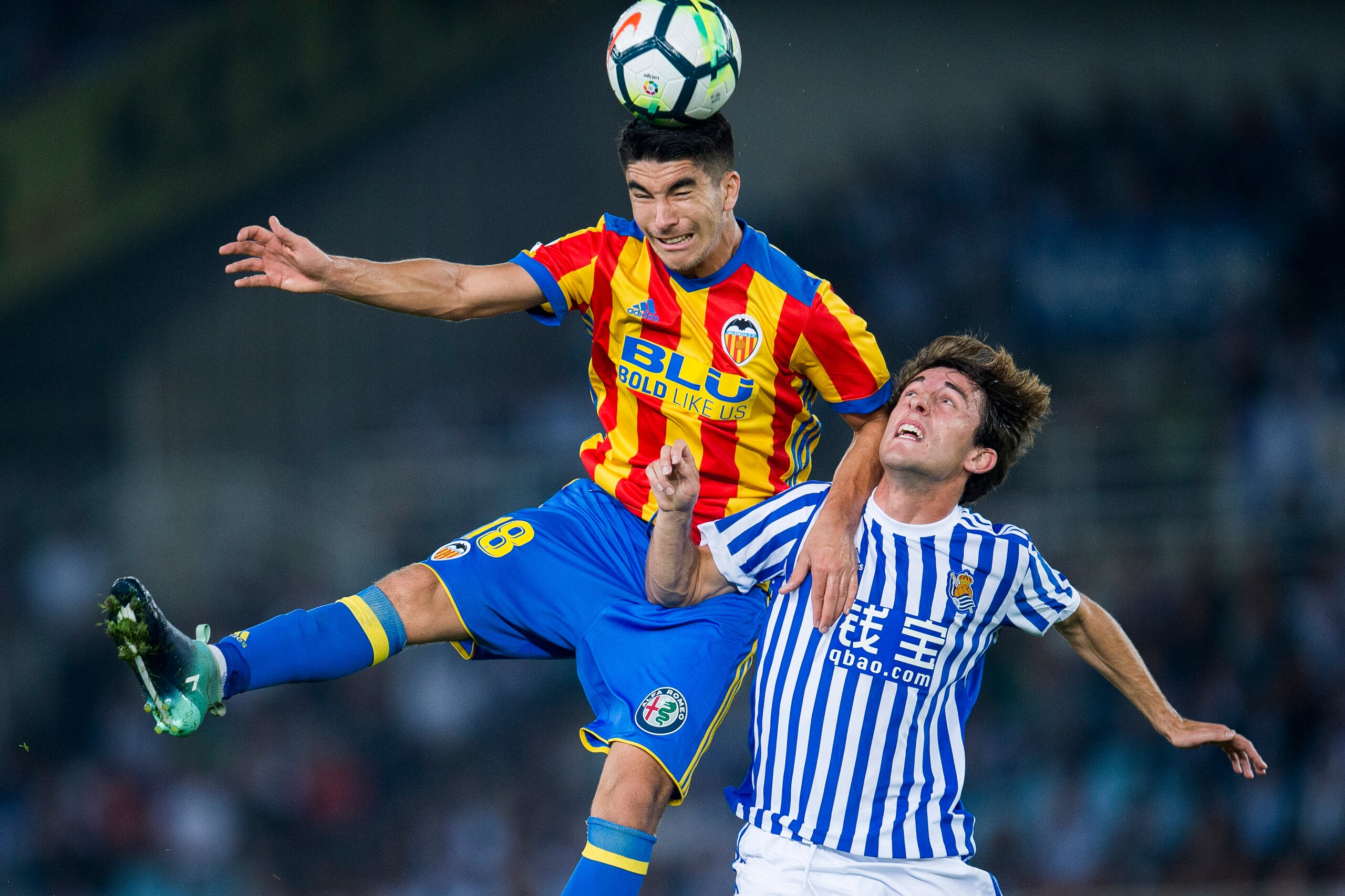 SAN SEBASTIAN, SPAIN - SEPTEMBER 24:  Carlos Soler of Valencia CF duels for the ball with Alvaro Odriozola of Real Sociedad during the La Liga match between Real Sociedad de Futbol and Valencia CF at Estadio Anoeta on September 24, 2017 in San Sebastian, 