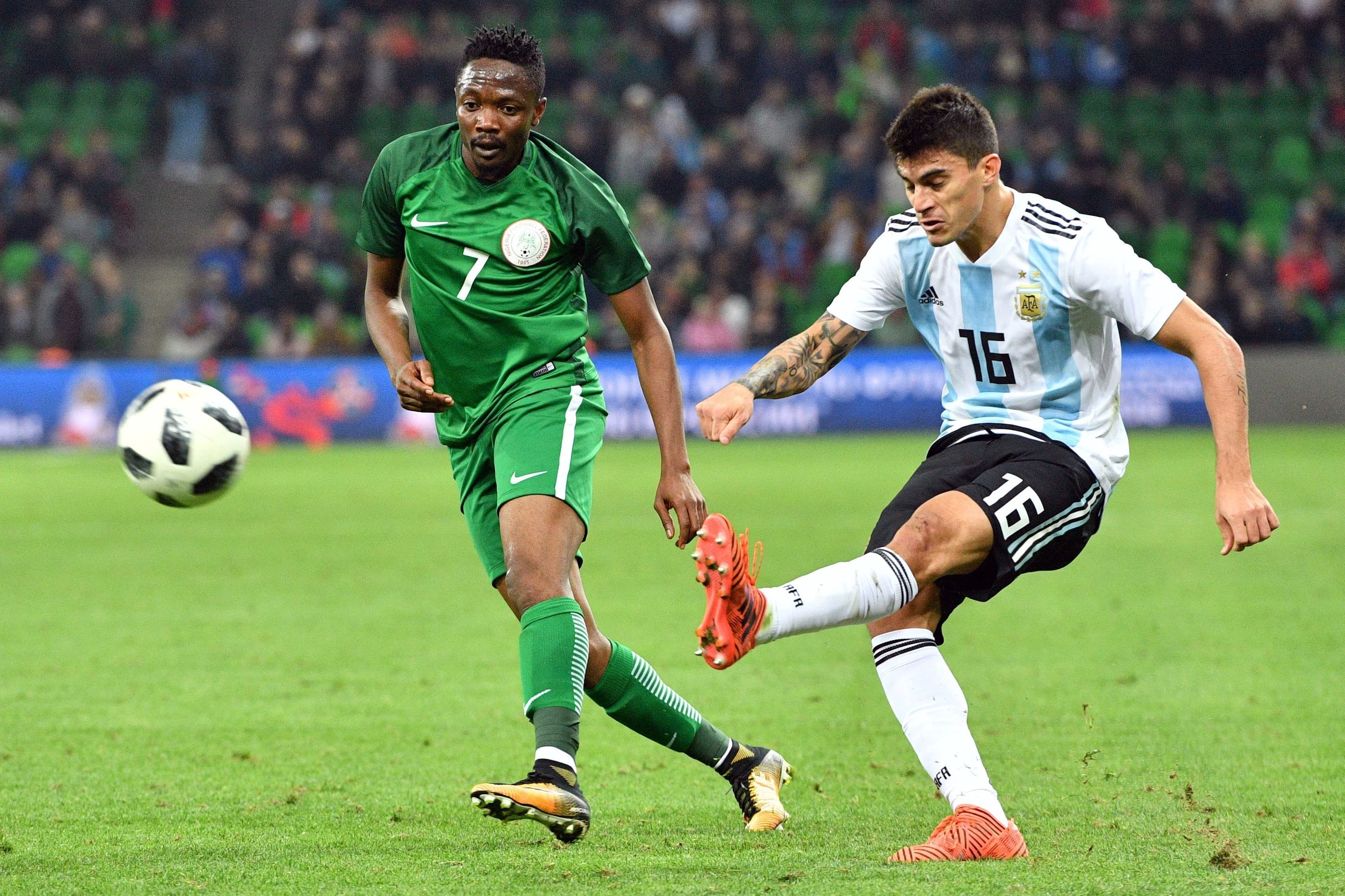 Nigeria's Ahmed Musa (L) and Argentina's Diego Perotti vie for the ball during an international friendly football match between Argentina and Nigeria in Krasnodar on November 14, 2017. / AFP PHOTO / Mladen ANTONOV        (Photo credit should read MLADEN A