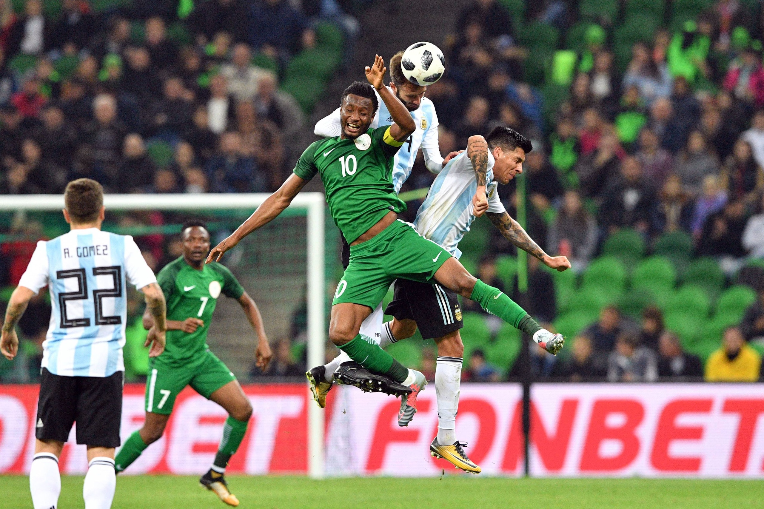 Nigeria's John Obi Mikel, Argentina's German Pezzella and Argentina's Enzo Perez vie for the ball during an international friendly football match between Argentina and Nigeria in Krasnodar on November 14, 2017. / AFP PHOTO / Mladen ANTONOV        (Photo c