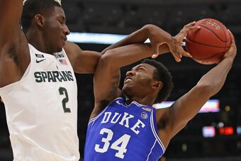 CHICAGO, IL - NOVEMBER 14:   Wendell Carter Jr #34 of the Duke Blue Devils is fouled by Jaren Jackson Jr. #2 of the Michigan State Spartans
during the State Farm Champions Classic at the United Center on November 14, 2017 in Chicago, Illinois. Duke defeat