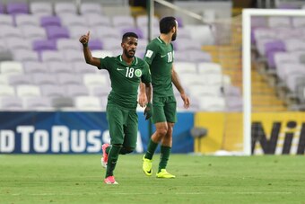 Saudi's midfielder Nawaf Al-Abid (R) celebrates scoring a penalty during the 2018 FIFA World Cup qualifier football match between UAE and Saudi Arabia at the Hazza Bin Zayed Stadium in Al-Ain on August 29, 2017. / AFP PHOTO / GIUSEPPE CACACE        (Photo
