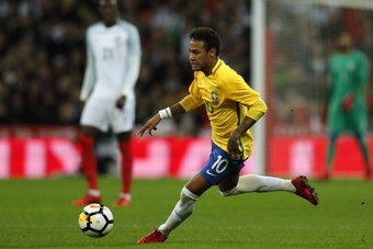 Brazil's striker Neymar runs with the ball during the international friendly football match between England and Brazil at Wembley Stadium in London on November 14, 2017. / AFP PHOTO / Adrian DENNIS / NOT FOR MARKETING OR ADVERTISING USE / RESTRICTED TO ED