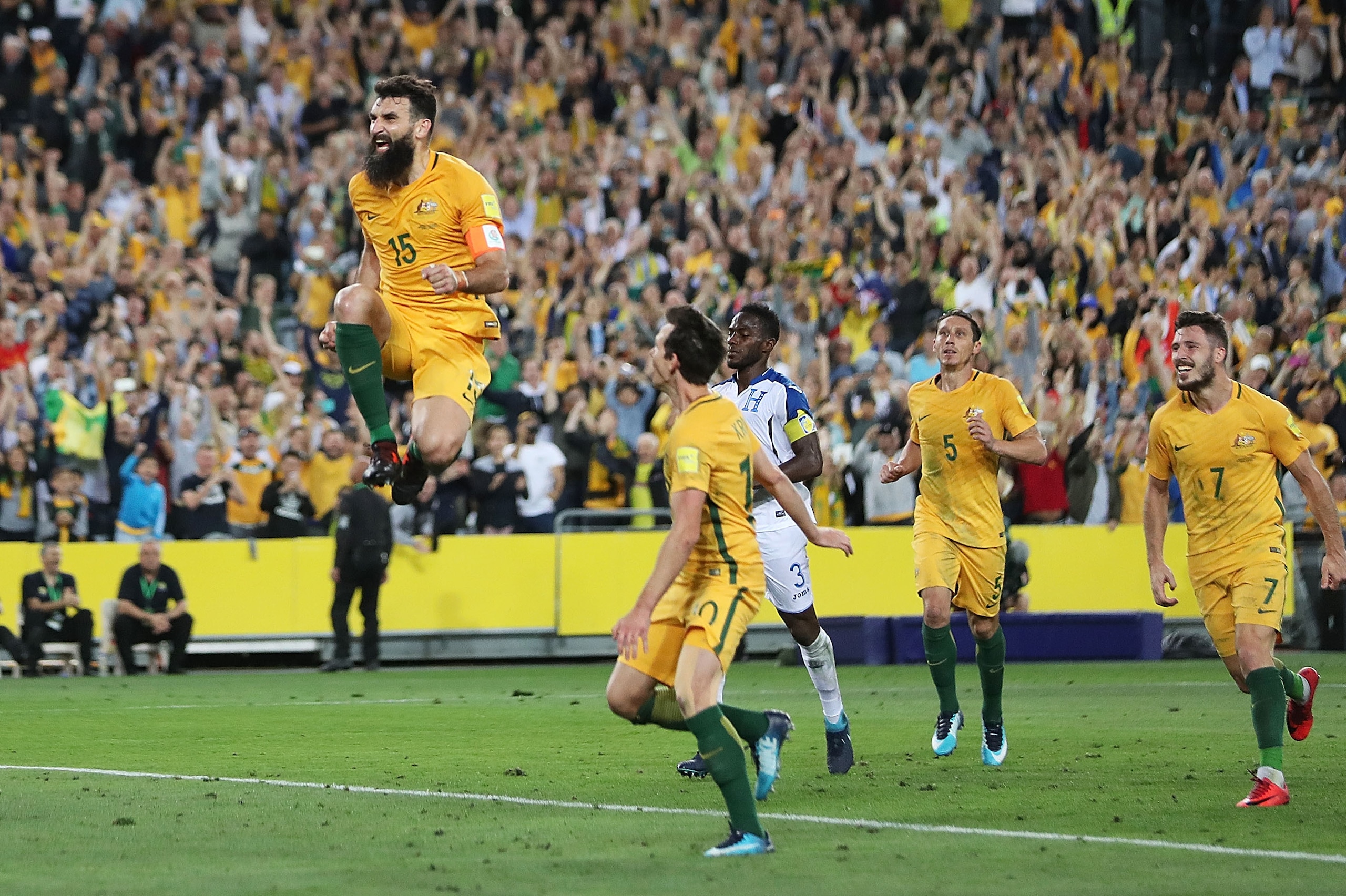 SYDNEY, AUSTRALIA - NOVEMBER 15:  Mile Jedinak of Australia celebrates scoring a goal during the 2018 FIFA World Cup Qualifiers Leg 2 match between the Australian Socceroos and Honduras at ANZ Stadium on November 15, 2017 in Sydney, Australia.  (Photo by 