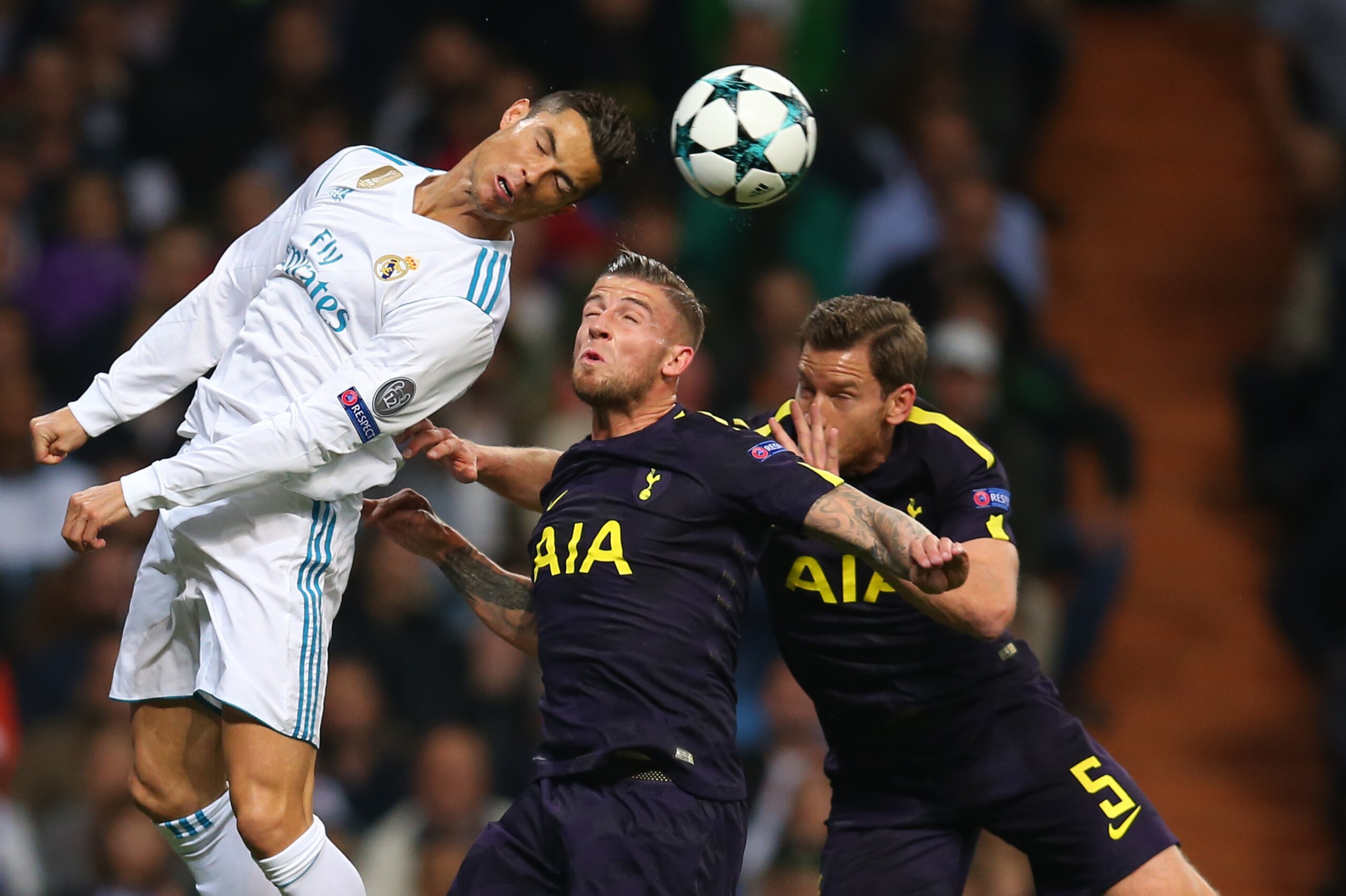 MADRID, SPAIN - OCTOBER 17: Cristiano Ronaldo of Real Madrid battles with Toby Alderweireld and Jan Vertonghen of Tottenham Hotspur during the UEFA Champions League group H match between Real Madrid and Tottenham Hotspur at Estadio Santiago Bernabeu on Oc