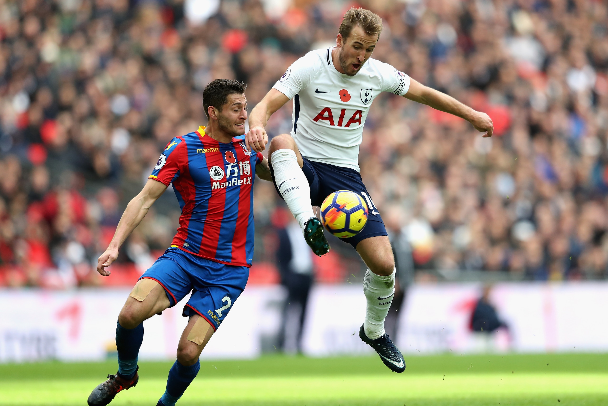 LONDON, ENGLAND - NOVEMBER 05: Joel Ward of Crystal Palace and Harry Kane of Tottenham Hotspur battle for possession during the Premier League match between Tottenham Hotspur and Crystal Palace at Wembley Stadium on November 5, 2017 in London, England.  (