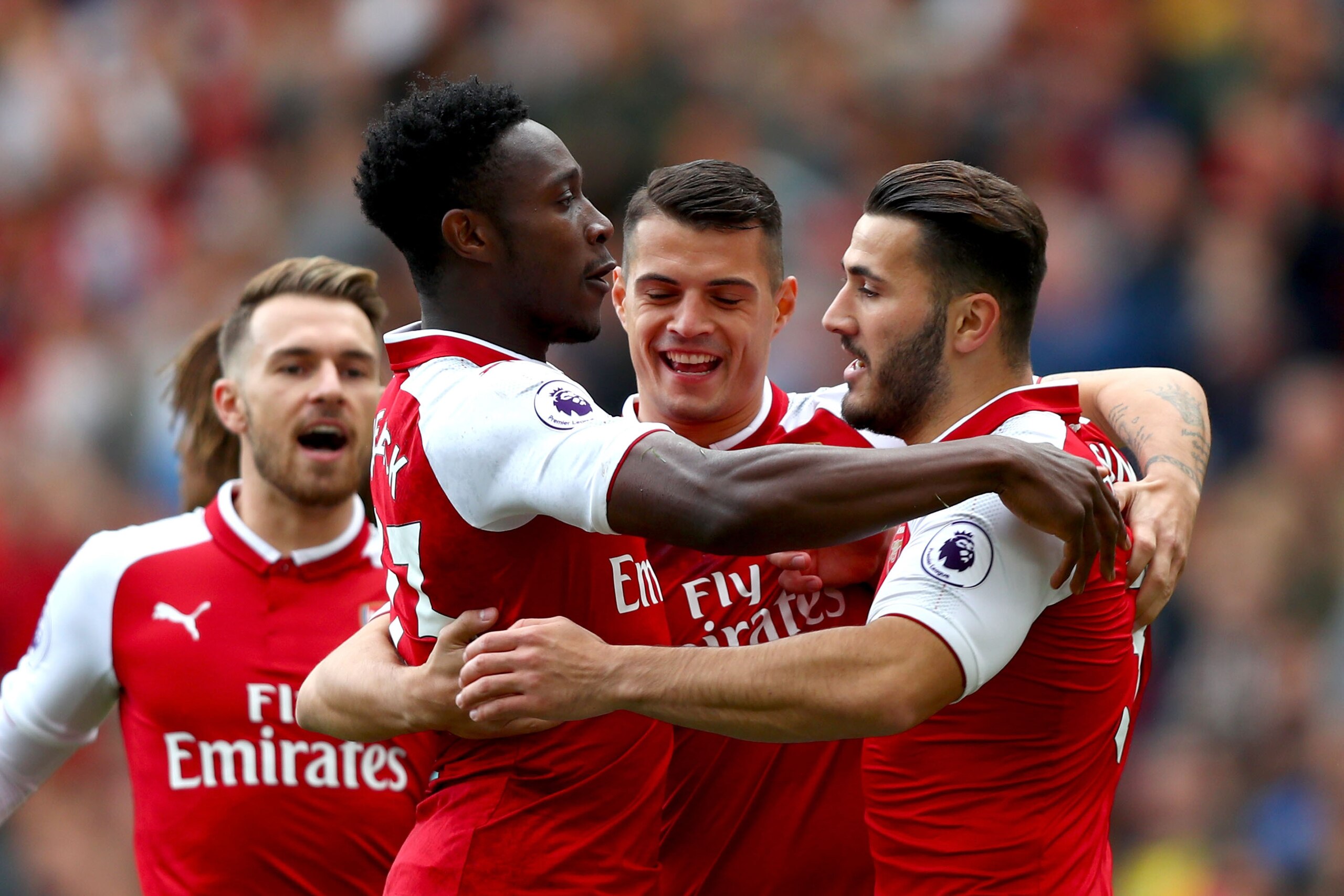 LONDON, ENGLAND - SEPTEMBER 09:  Danny Welbeck of Arsenal celebrates scoring his sides first goal with Granit Xhaka of Arsenal and Sead Kolasinac of Arsenal during the Premier League match between Arsenal and AFC Bournemouth at Emirates Stadium on Septemb