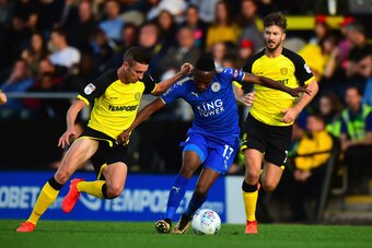 BURTON-UPON-TRENT, ENGLAND - AUGUST 01:  Ahmed Musa of Leicester City holds off a challenge from Matthew Lund of Burton Albion during the Pre-Season Friendly match between Burton Albion v Leicester City at Pirelli Stadium on August 1, 2017 in Burton-upon-