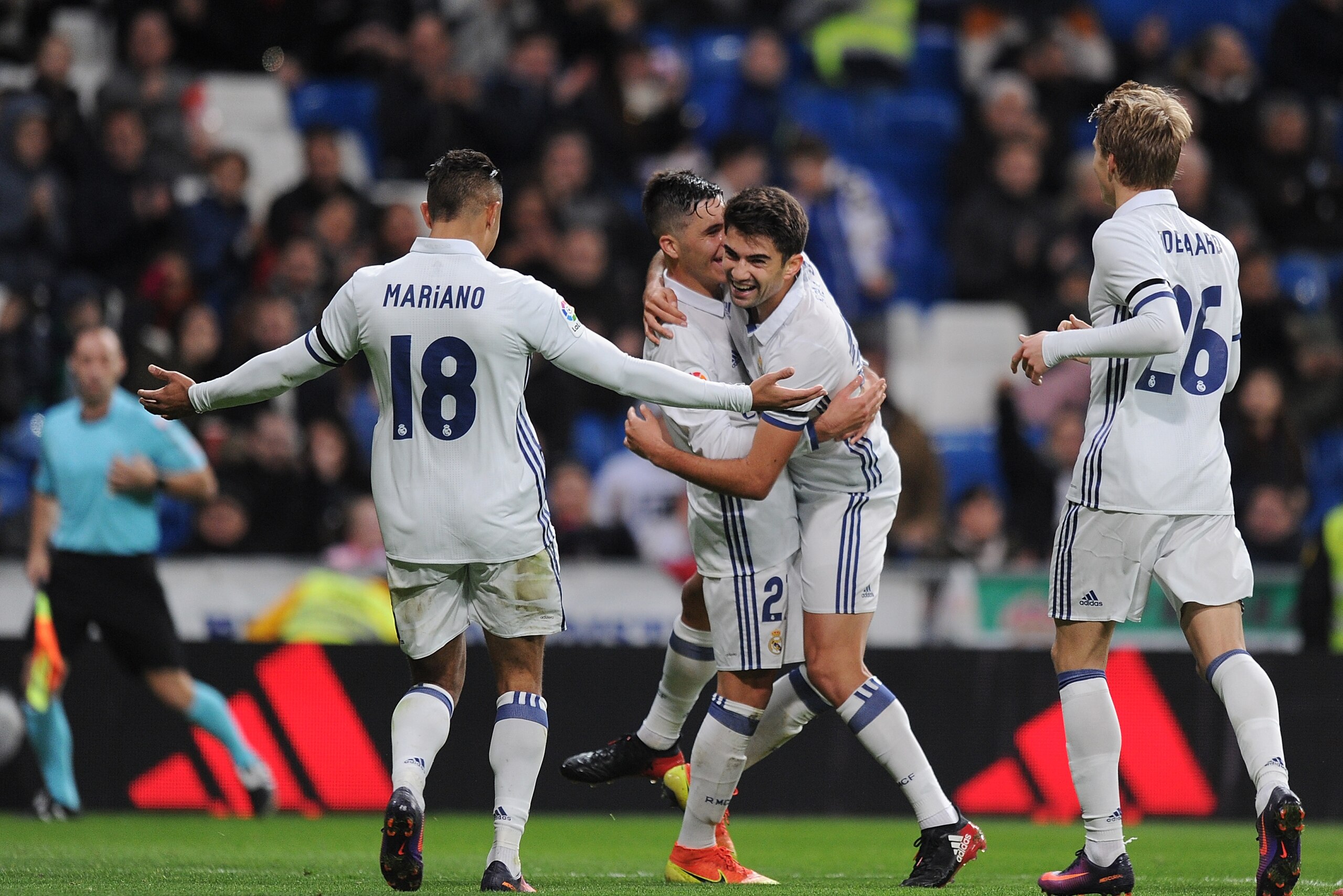 MADRID, SPAIN - NOVEMBER 30:  Enzo Zidane of Real Madrid CF celebrates with Alvaro Tejero and Mariano Diaz Mejia after scoring Real's 4th goal during the Copa del Rey last of 32 match between Real Madrid and Cultural Leonesa at estadio Santiago Bernabeu o