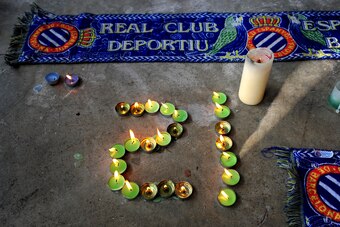 BARCELONA, SPAIN - AUGUST 09:  Candles burn forming the jersey number of late Espanyol captain Daniel Jarque, at the Nuevo Estadio de Cornella-El Prat on August 9, 2009 in Barcelona, Spain. The 26-year-old midfielder died after suffering a heart attack wh
