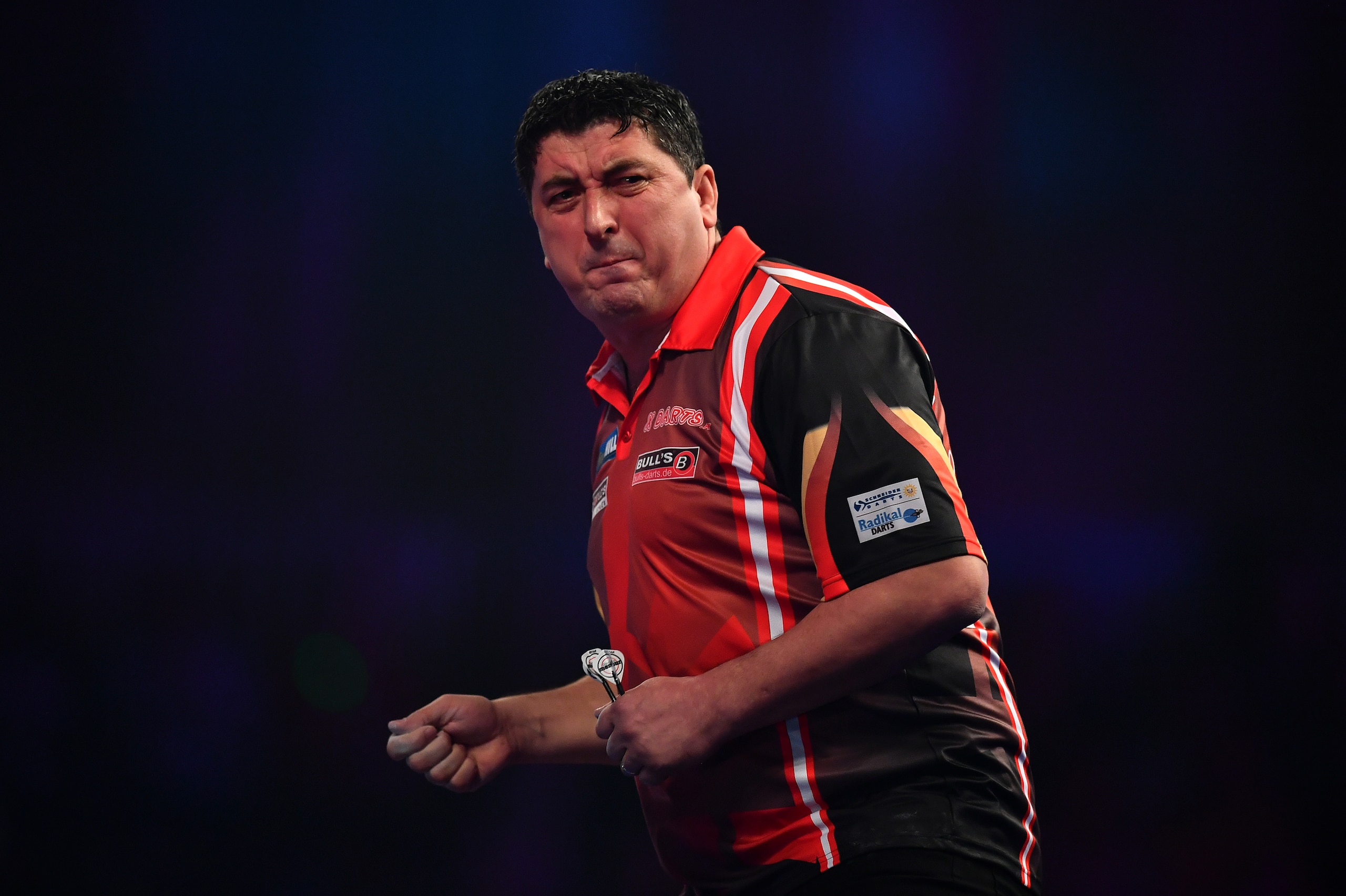 LONDON, ENGLAND - DECEMBER 21:  Mensur Suljovic of Serbia reacts during his first round match against Ron Meulenkamp of the Netherlands on day seven of the 2017 William Hill PDC World Darts Championships at Alexandra Palace on December 21, 2016 in London,