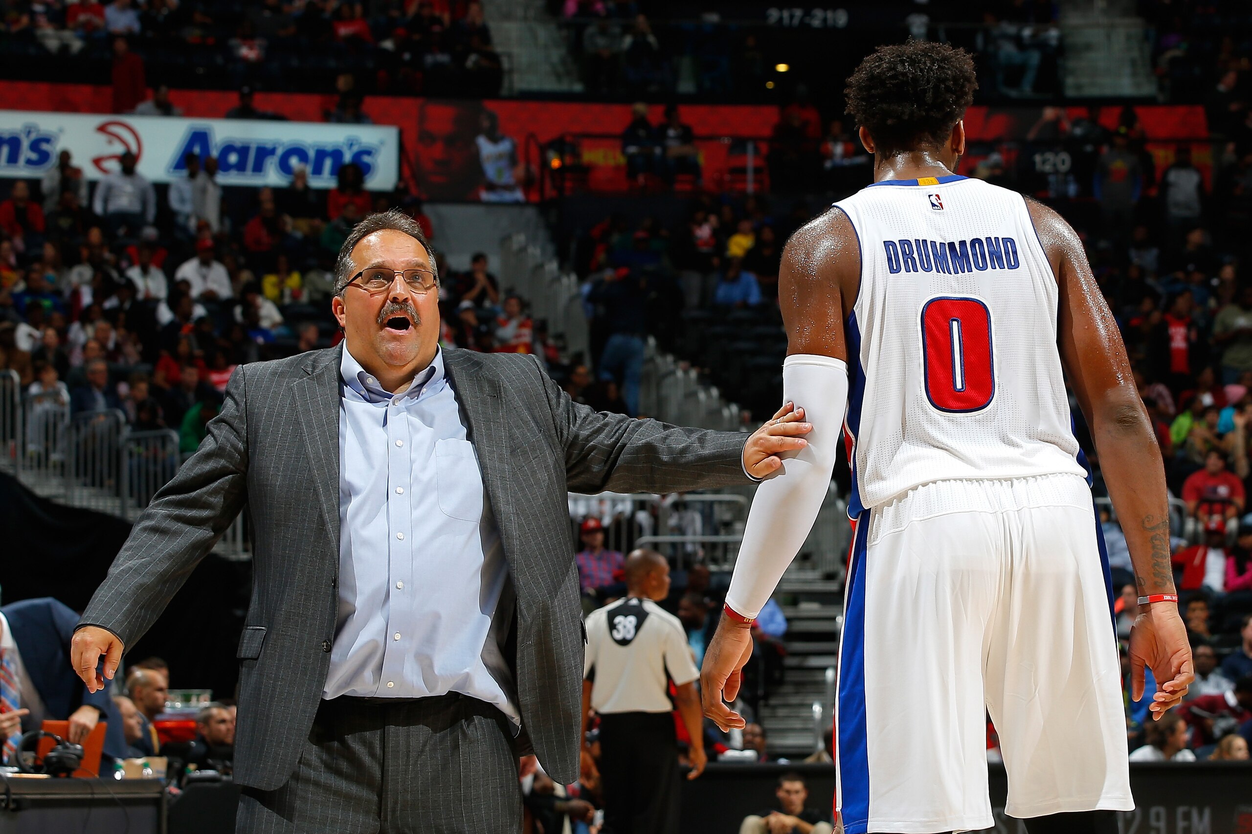 ATLANTA, GA - OCTOBER 27:  Stan Van Gundy of the Detroit Pistons converses with Andre Drummond #0 in the final seconds of their 106-94 win over the Atlanta Hawks at Philips Arena on October 27, 2015 in Atlanta, Georgia.  NOTE TO USER User expressly acknow