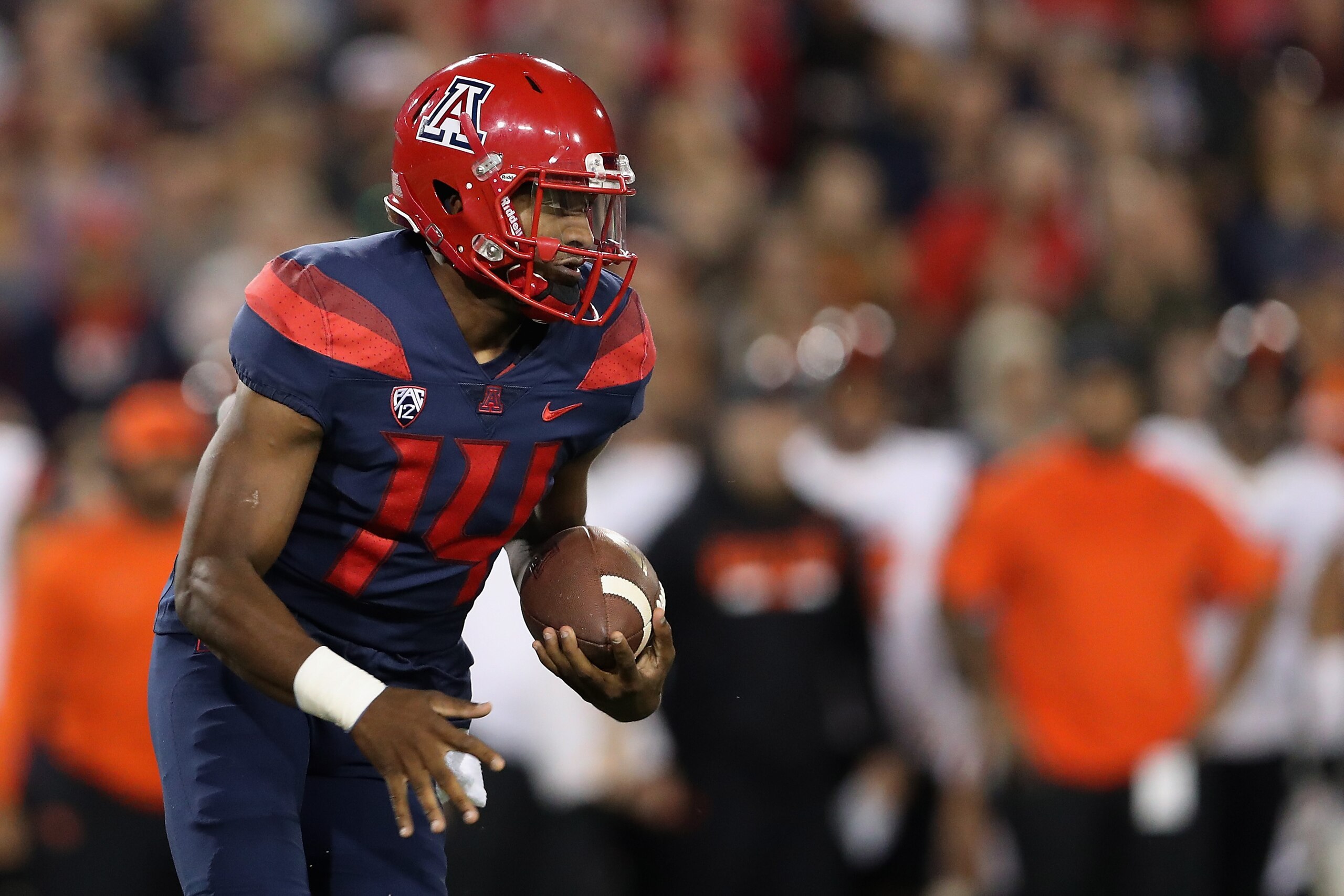 TUCSON, AZ - NOVEMBER 11:  Quarterback Khalil Tate #14 of the Arizona Wildcats scrambles with the football during the second half of the college football game against the Oregon State Beavers at Arizona Stadium on November 11, 2017 in Tucson, Arizona.  (P