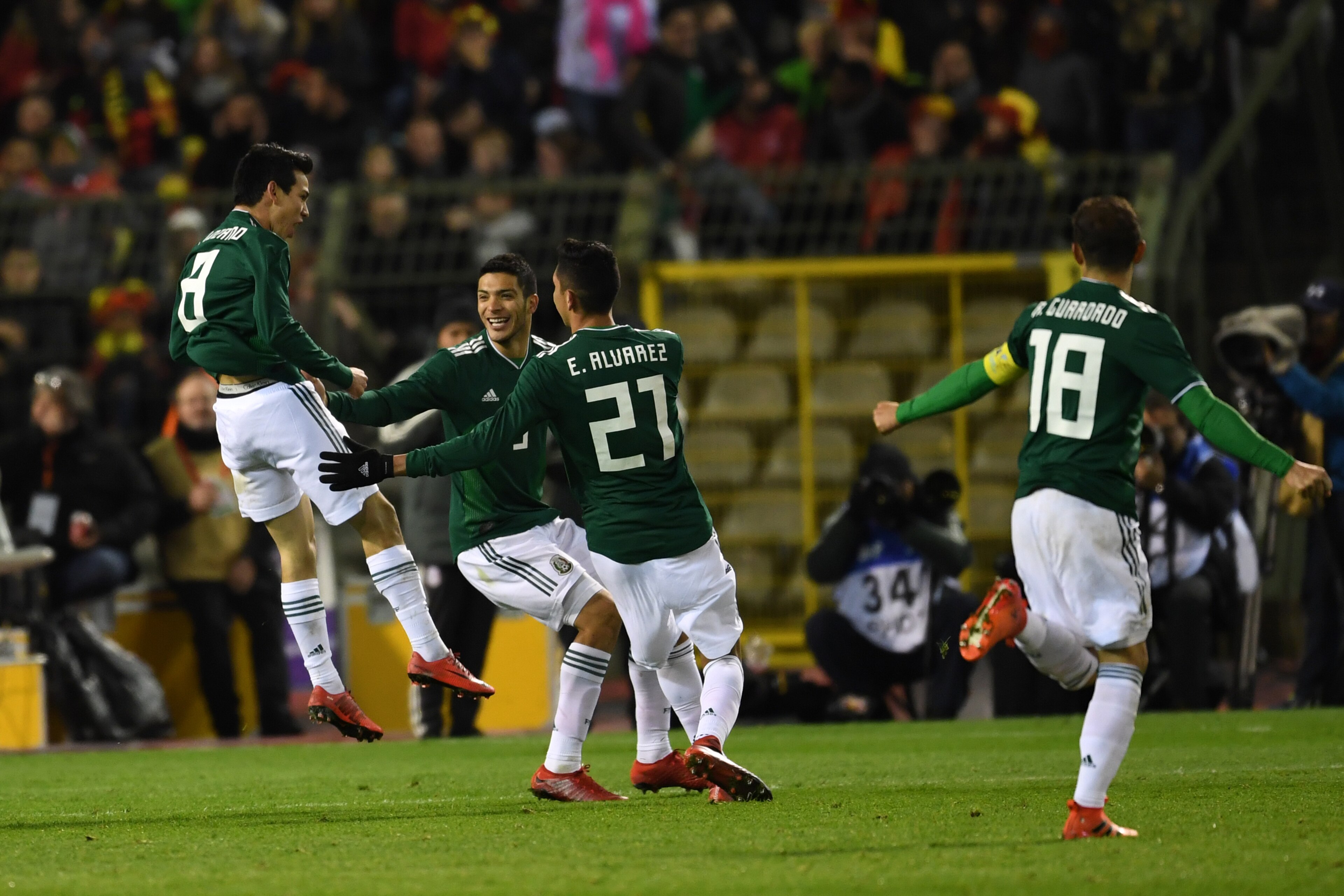 BRUSSELS, BELGIUM - NOVEMBER 10:  Hirving Lozano (L) of Mexico celebrates scoring his side's third goal during the international friendly match between Belgium and Mexico at King Baudouin Stadium on November 10, 2017 in Brussels, Belgium.  (Photo by Etsuo