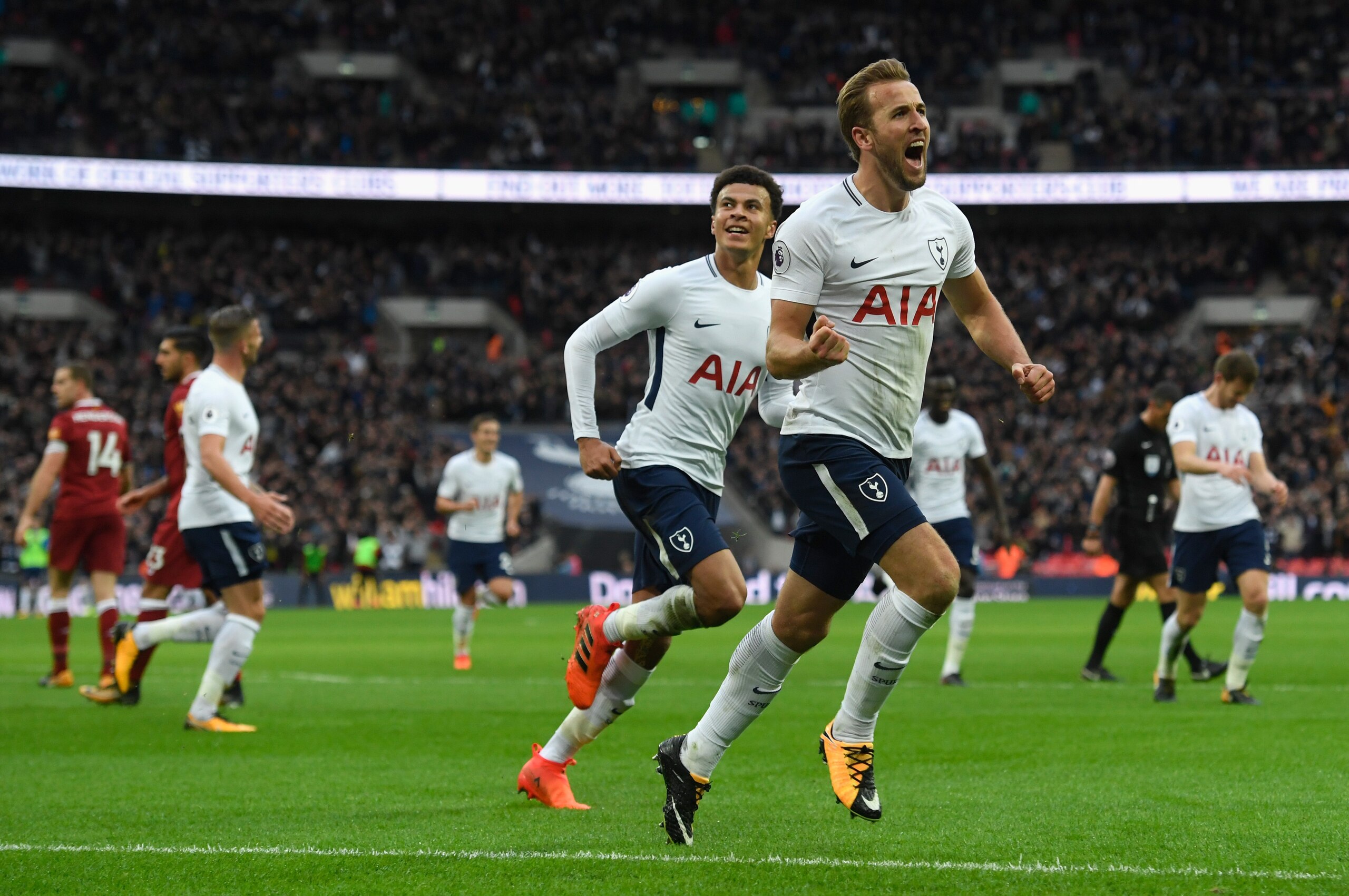 LONDON, ENGLAND - OCTOBER 22:  Harry Kane of Spurs (r) celebrates with Dele Ali after scoring the fourth goal and his second of the game during the Premier League match between Tottenham Hotspur and Liverpool at Wembley Stadium on October 22, 2017 in Lond