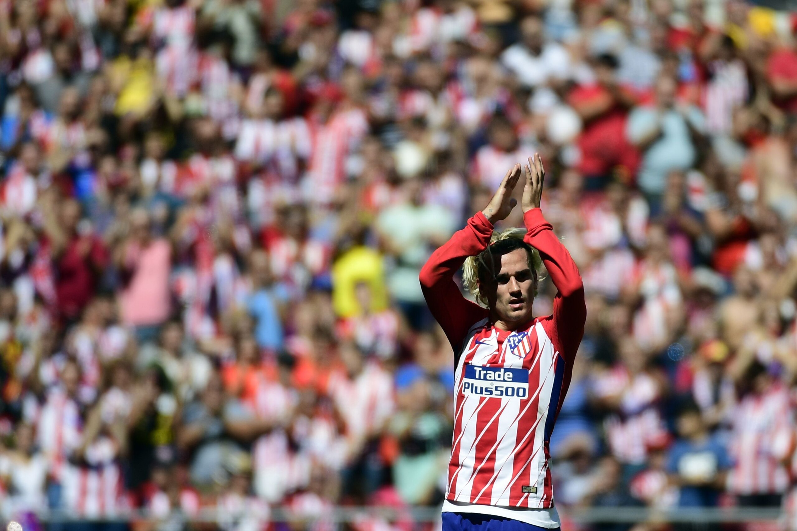 Atletico Madrid's forward from France Antoine Griezmann celebrates a goal during the Spanish league football match Club Atletico de Madrid vs Sevilla FC at the Wanda Metropolitano stadium in Madrid on September 23, 2017. / AFP PHOTO / PIERRE-PHILIPPE MARC
