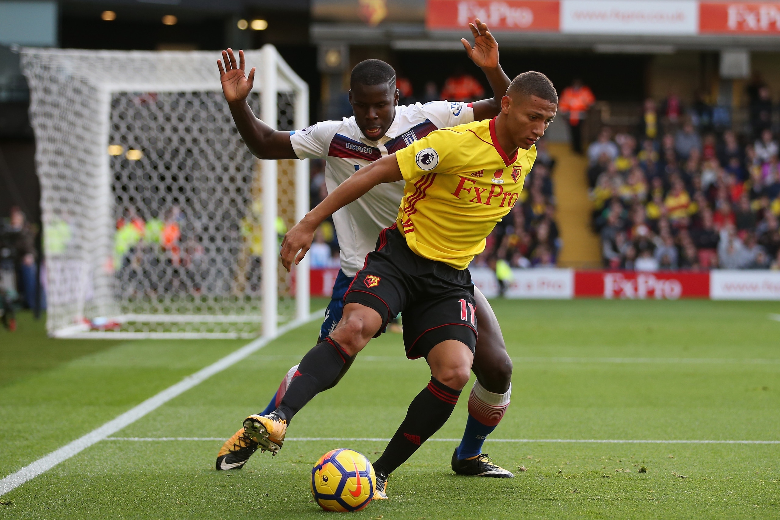WATFORD, ENGLAND - OCTOBER 28: Kurt Zouma of Stoke City and Richarlison de Andrade of Watford battle for possession during the Premier League match between Watford and Stoke City at Vicarage Road on October 28, 2017 in Watford, England. (Photo by Alex Mo WATFORD, ENGLAND - OCTOBER 28: Kurt Zouma of Stoke City and Richarlison de Andrade of Watford battle for possession during the Premier League match between Watford and Stoke City at Vicarage Road on October 28, 2017 in Watford, England. (Photo by Alex Mo